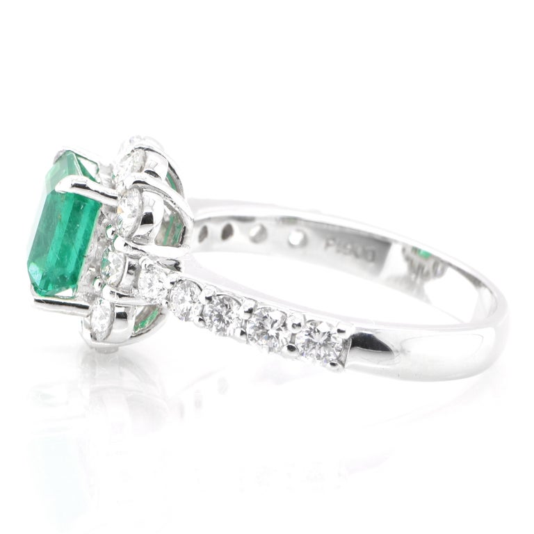 Emerald Cut 1.36 Carat Natural Colombian, Vivid Green Emerald Halo Ring Set in Platinum For Sale