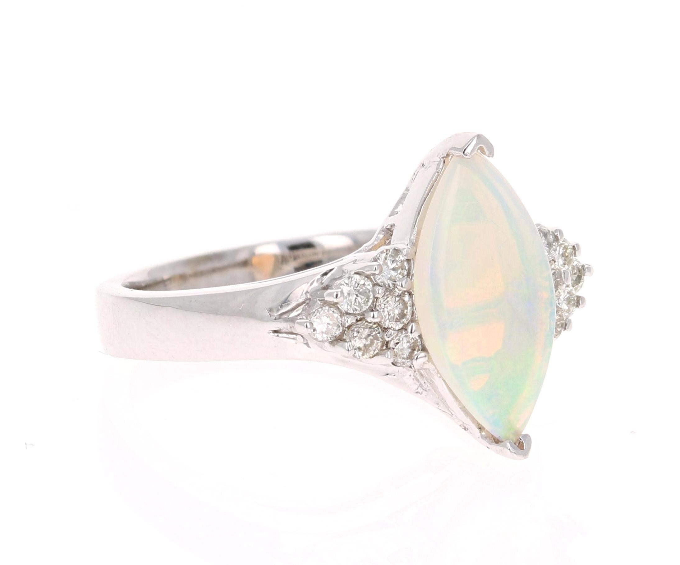 Cut and Dainty Opal and Diamond Ring!

This ring has a 1.07 Carat Marquise Cut Opal that is curated in a cute 14 Karat White Gold setting. The setting is adorned with 12 Round Cut Diamonds that weigh 0.29 Carats. The total carat weight of the ring