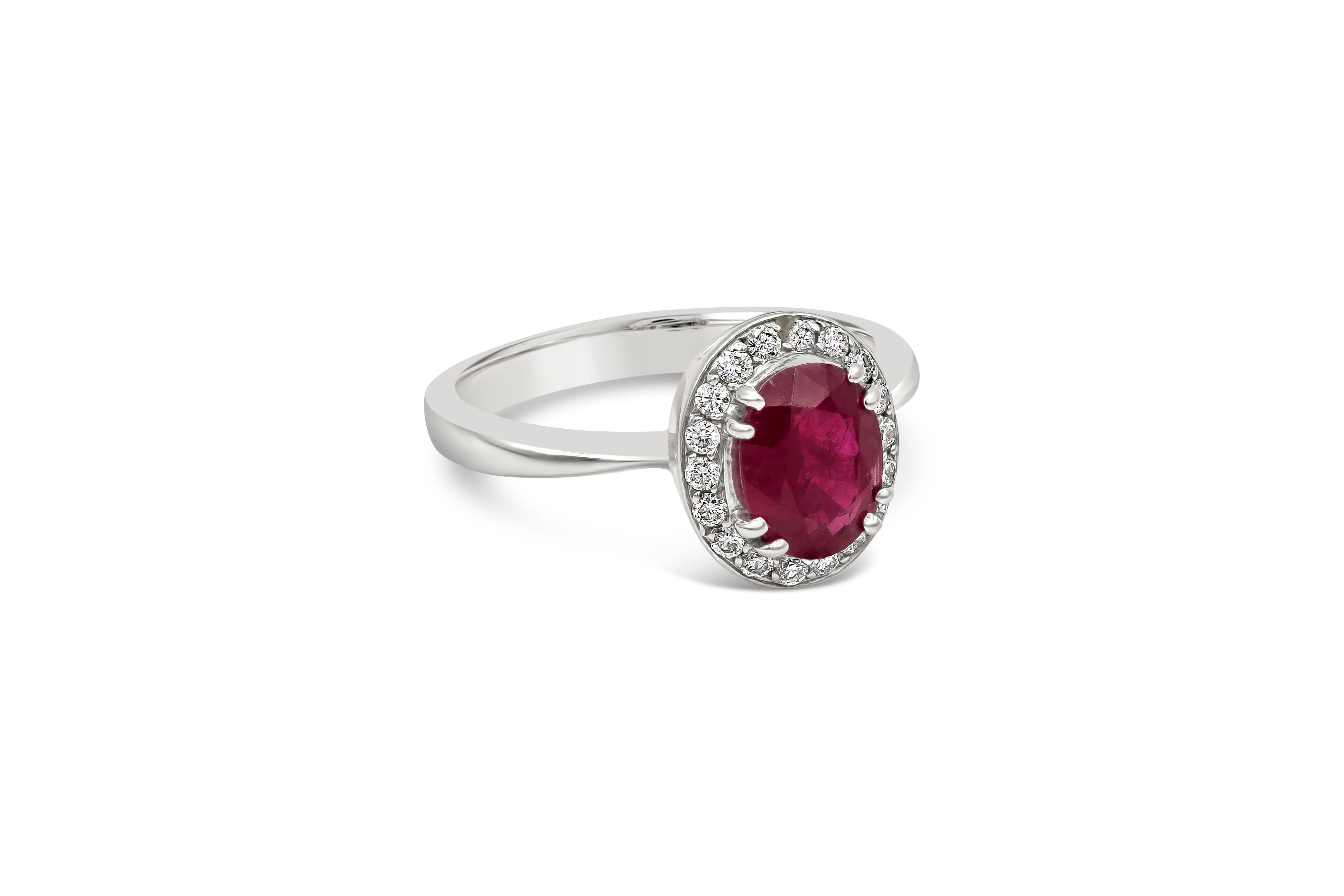 Showcasing a vibrant oval cut ruby weighing 1.36 carat total, surrounded by a row of brilliant round diamonds in a halo design weighing 0.19 carats total. Made with 14K White Gold, Size 6 US

Roman Malakov is a custom house, specializing in creating