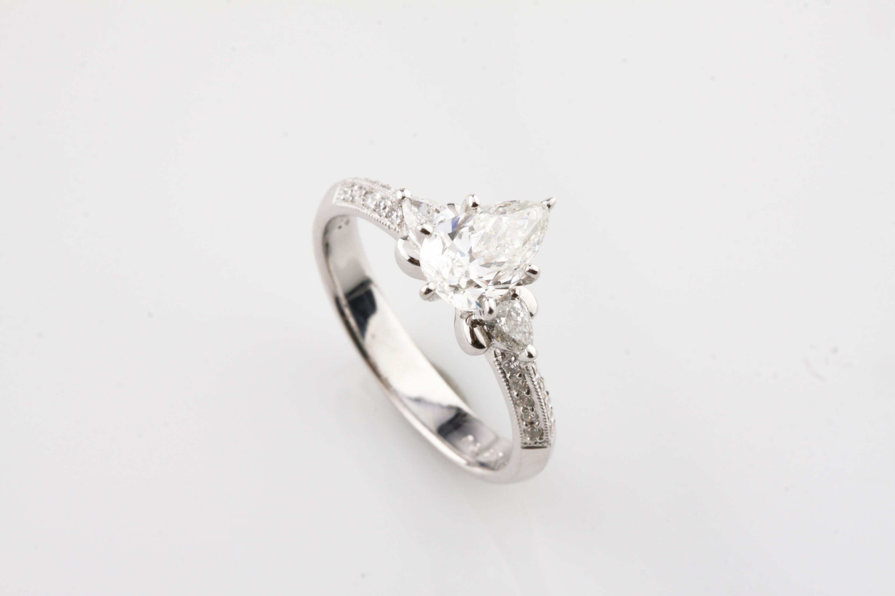 One electrically tested 18KT white gold ladies cast & assembled diamond unity ring with a bright finish. Condition is new, good workmanship. The ring features a diamond solitaire, supported by diamonds set shoulders, completed by a three millimeter