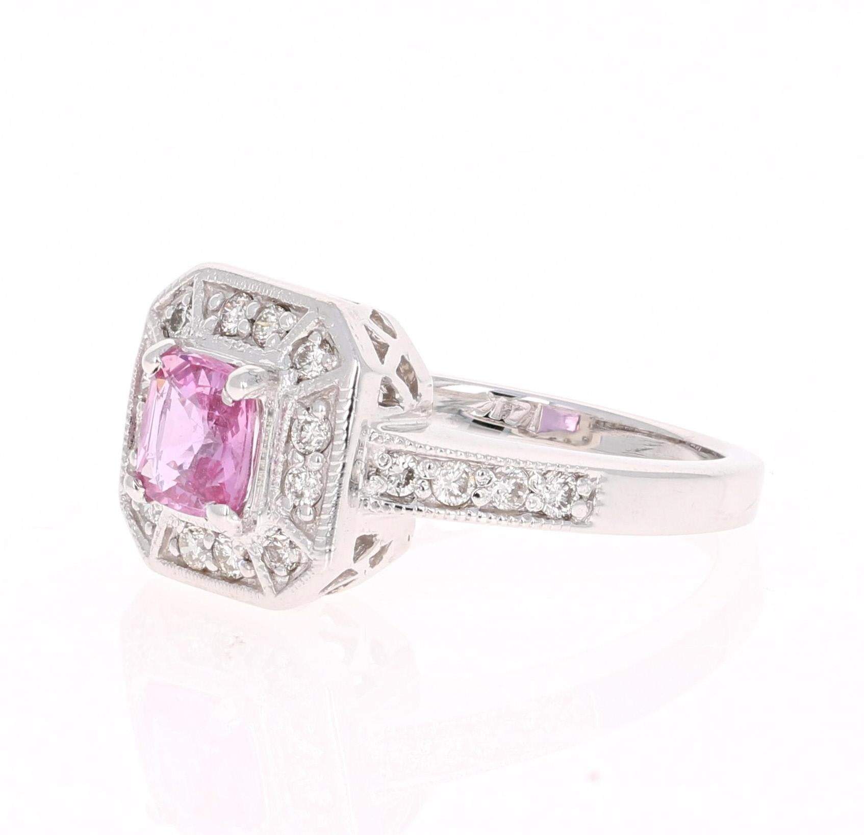 Beautiful Pink Sapphire Diamond Ring with a beautiful vintage-style setting! Can be a antique-style Engagement Ring or Cocktail Ring! 
The center Cushion Cut Pink Sapphire is 1.00 Carat and is surrounded by 20 Round Cut Diamonds weighing 0.36