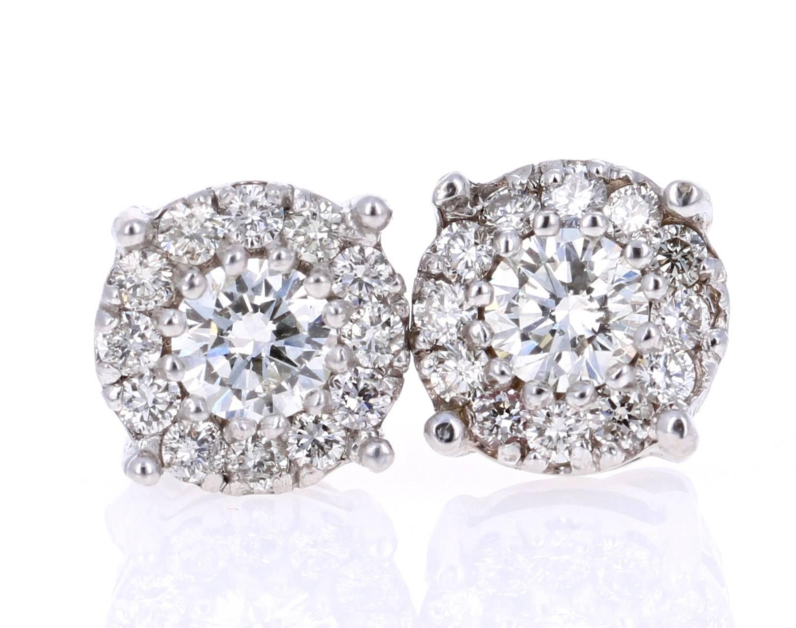 
1.36 Carat Round Diamond Floret Design 14K White Gold Stud Earrings!

This classic design of diamond earrings has 2 Round Cut Diamonds set in the center of the earrings that weigh 0.64 carats and there also 24 small Round Cut Diamonds that weigh