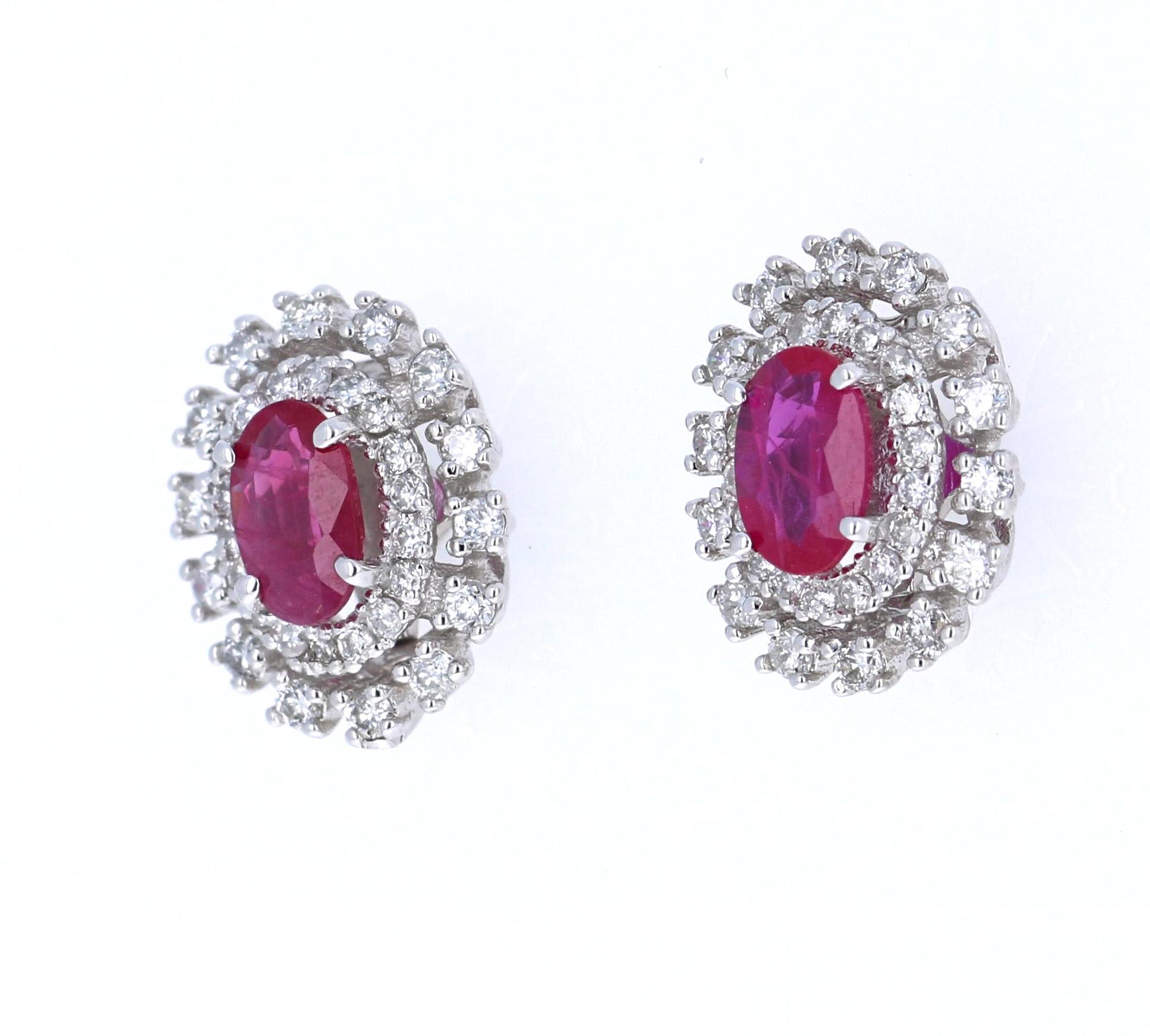 These absolute beauties have 2 Natural Rubies that weigh 0.86 Carats and are surrounded by 64 Round Cut Diamonds that weigh 0.50 Carats. (Clarity: VS, Color: H)

They are made in 14 Karat White Gold and weigh approximately 2.6 grams. The setting of