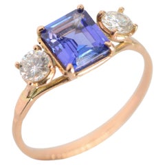 1.36 Carat Tanzanite and 0.82 ctw Diamond 14k Gold Three Stone Ring