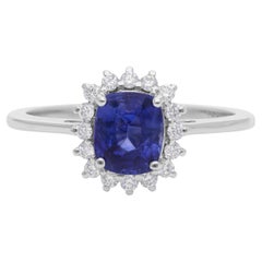 Anillo de compromiso con halo de diamantes y zafiro azul natural de 1,36 quilates en oro blanco de 18 quilates