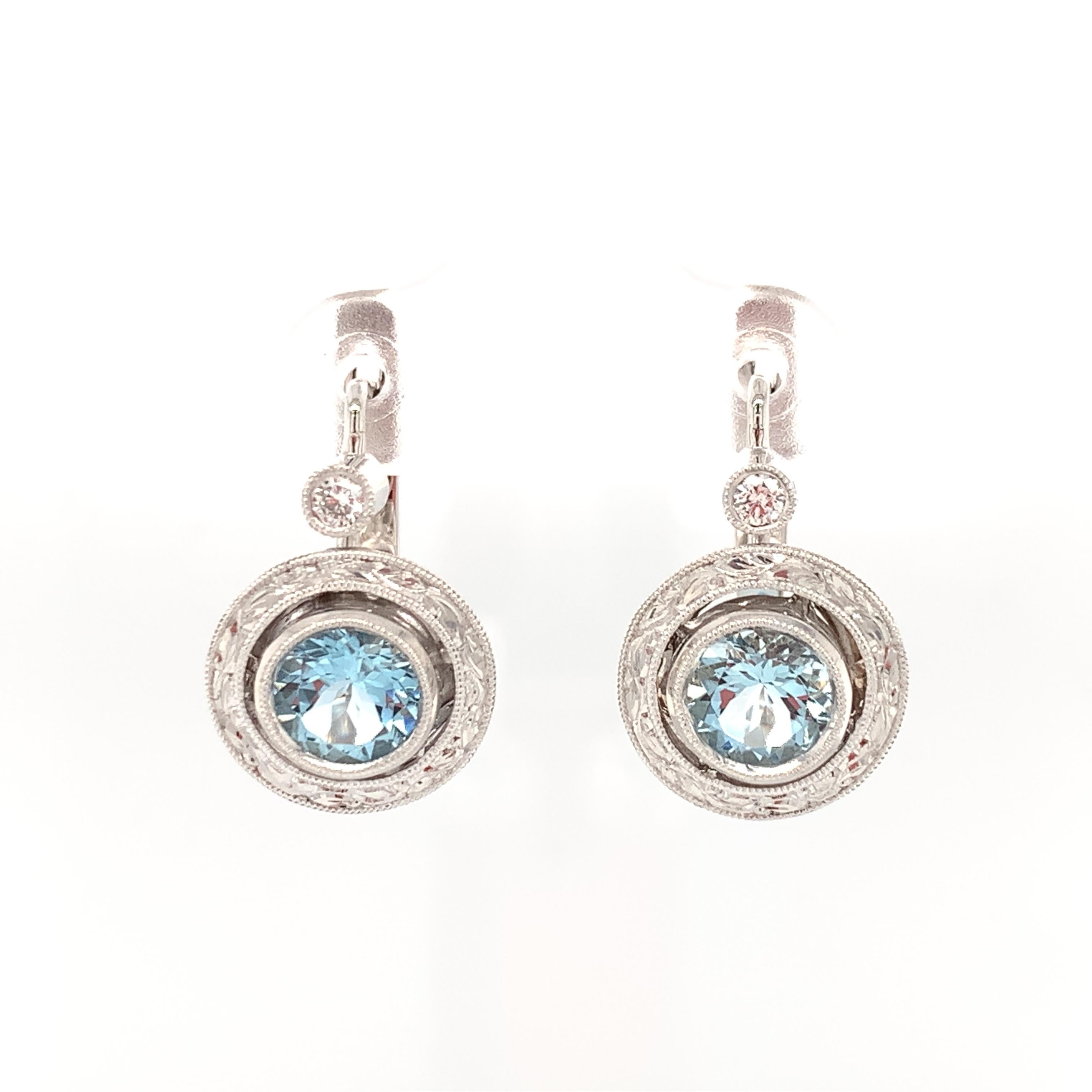 These lever back earrings feature brilliant powder blue aquamarines and sparkling diamonds set in beautifully engraved 18k white golds bezels. This is one of our most popular signature designs, handcrafted by our Master Jewelers in Los Angeles.