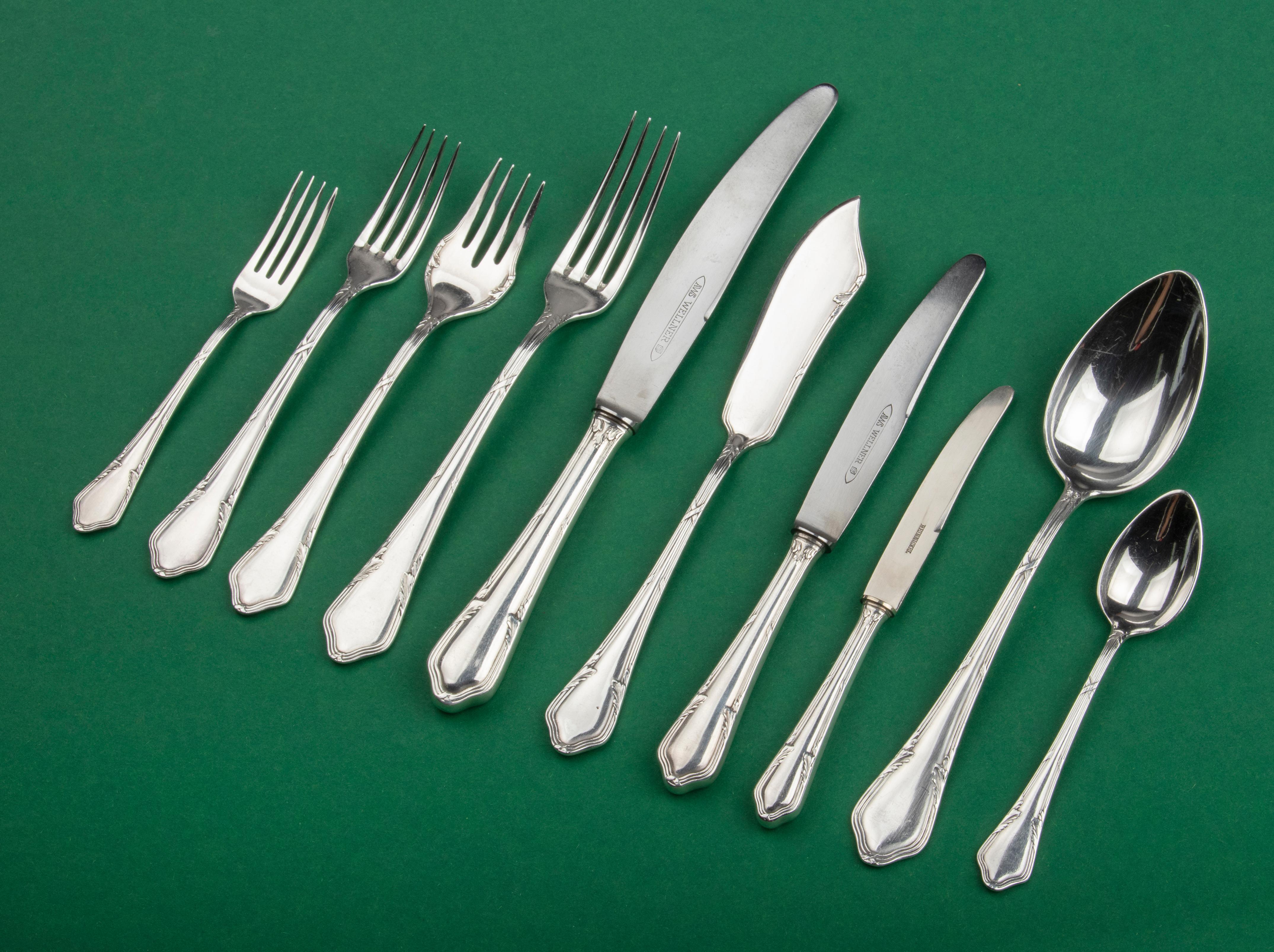 Nice set of silver plated flatware for 12 persons made by August Wellner and Sons, Germany. The cutlery has a cross band pattern. The silver color is beautiful, with a nice shine. The cutlery comes in the original case. The set is composed as