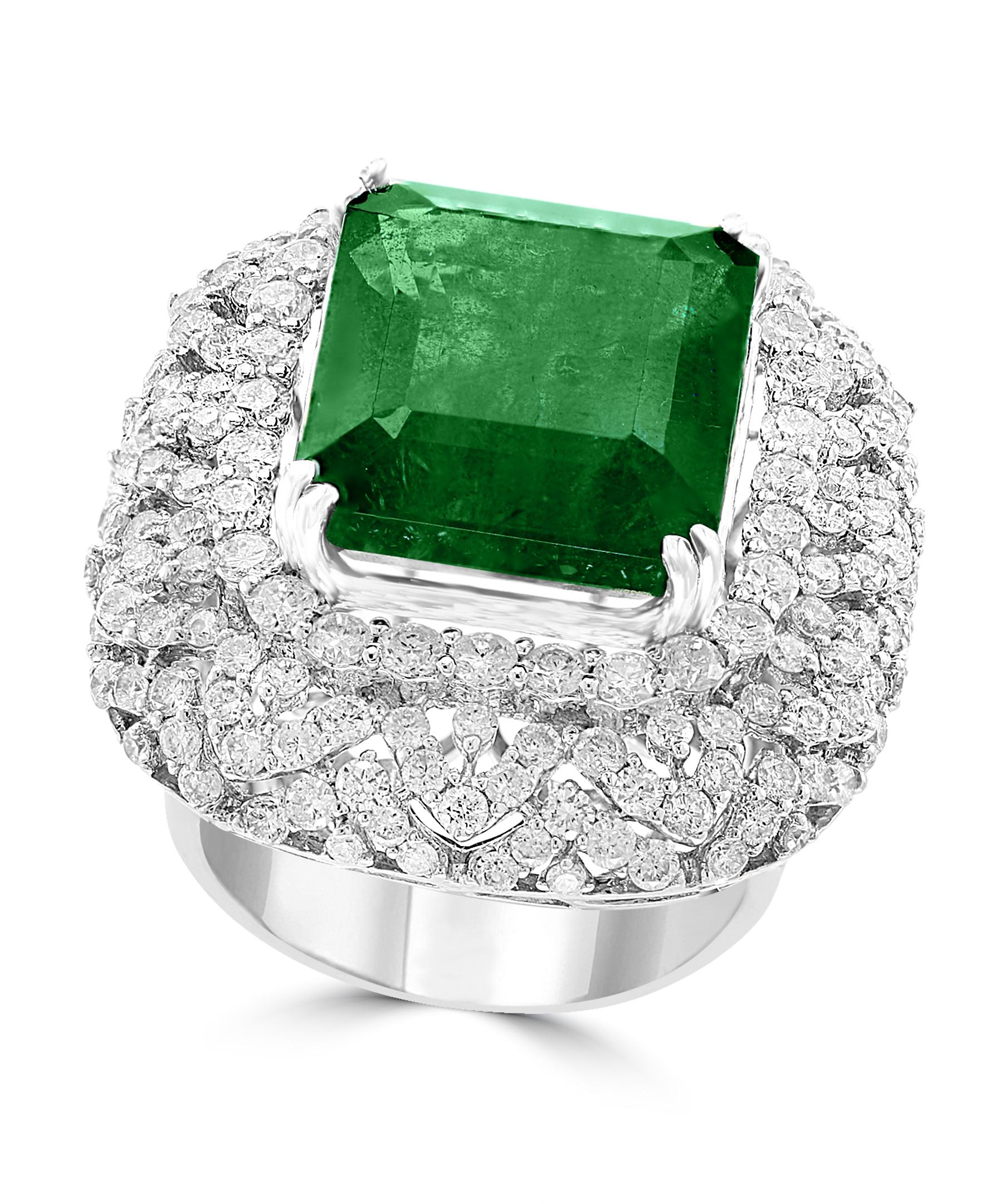 A classic, cocktail ring 
13.62 Carat   Emerald and Diamond Ring, Estate
with a color and clarity of F/G and VS1/VS2, respectively with no color enhancement.
Gold: 18 carat White gold 
Weight: 17 gram
 Diamonds: approximate 4.52 Carat 
Emerald: