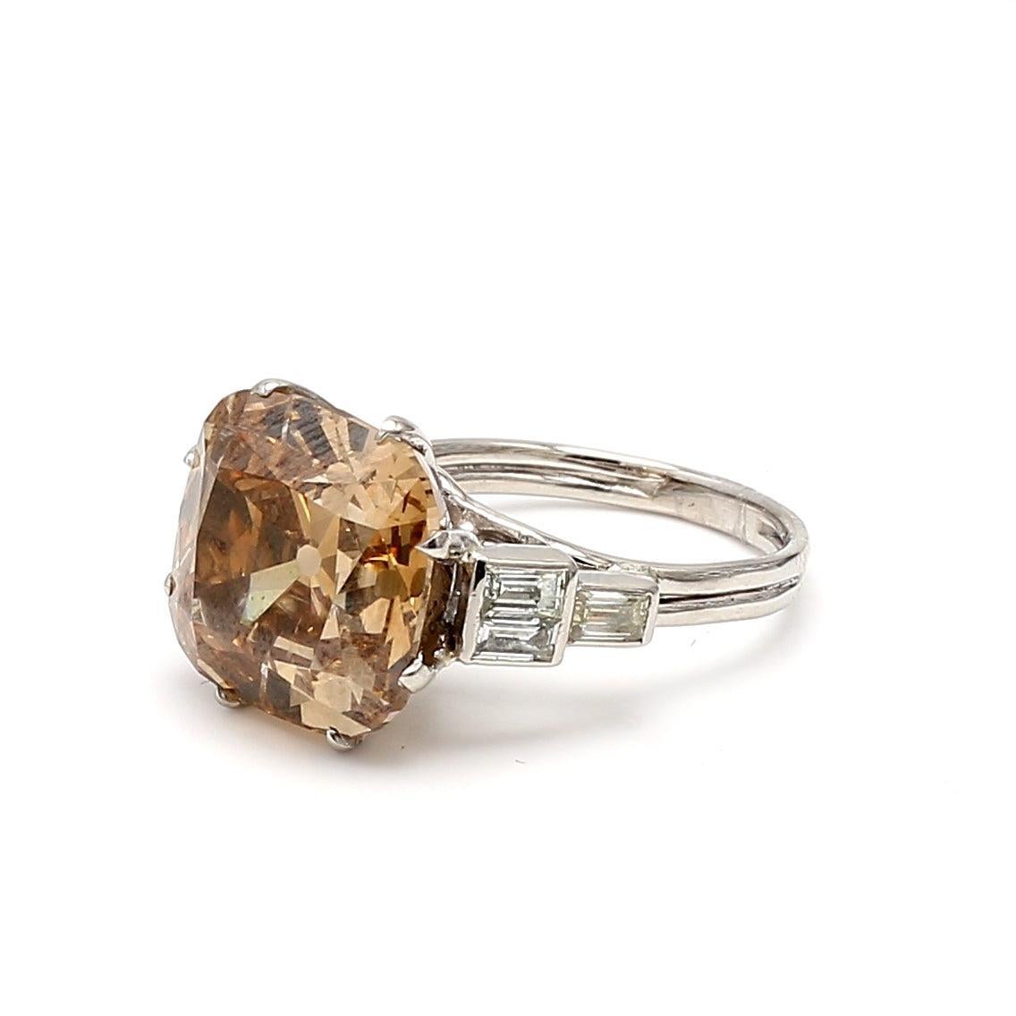 Title:
13.63 Carat Cushion Modified Brilliant Cut Fancy Deep Brown Yellow-G VS1 Diamond Platinum Cocktail Ring


Style:
Cocktail


Metal:
Platinum


Gemstone 1:
13.03 Carat Diamond


Number of Stones:
1


Color:
FDBY


Shape:
Cushion Modified