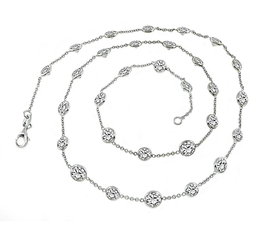 This is a stunning 14k white gold by the yard necklace. The necklace is set with sparkling round cut diamonds that weigh approximately 13.63ct. The color of these diamonds is I-L with VS2-SI2 clarity. The necklace measures 18 1/4 inches in length
