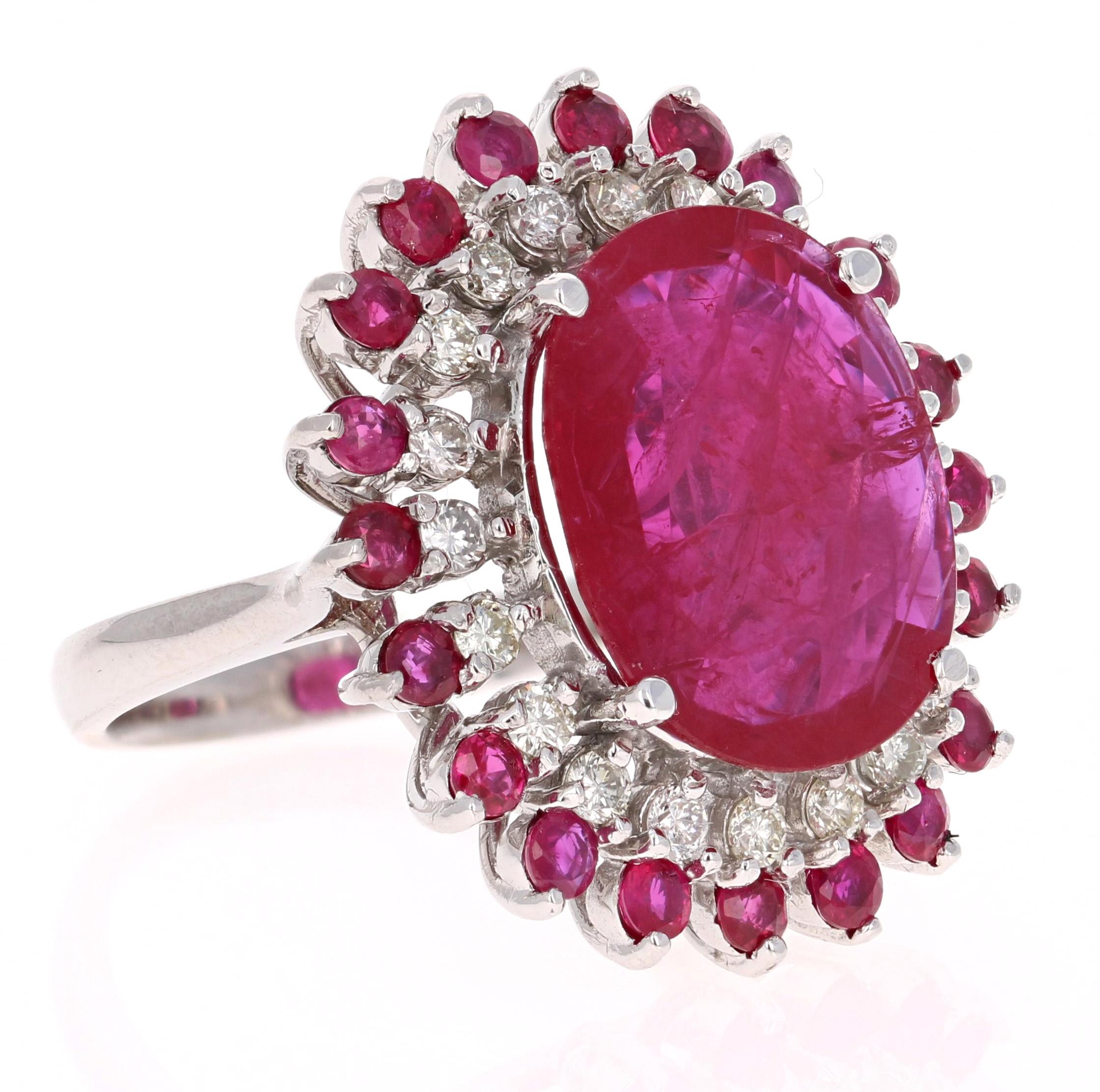 A real statement piece - 13.68 Carat Ruby and Diamond Cocktail Ring in 14K White Gold!
This ring has a gorgeous and large 11.47 Carat Oval Cut Ruby set in the center that measures at 17 mm x 14 mm and is surrounded by a row of 20 Round Cut Diamonds