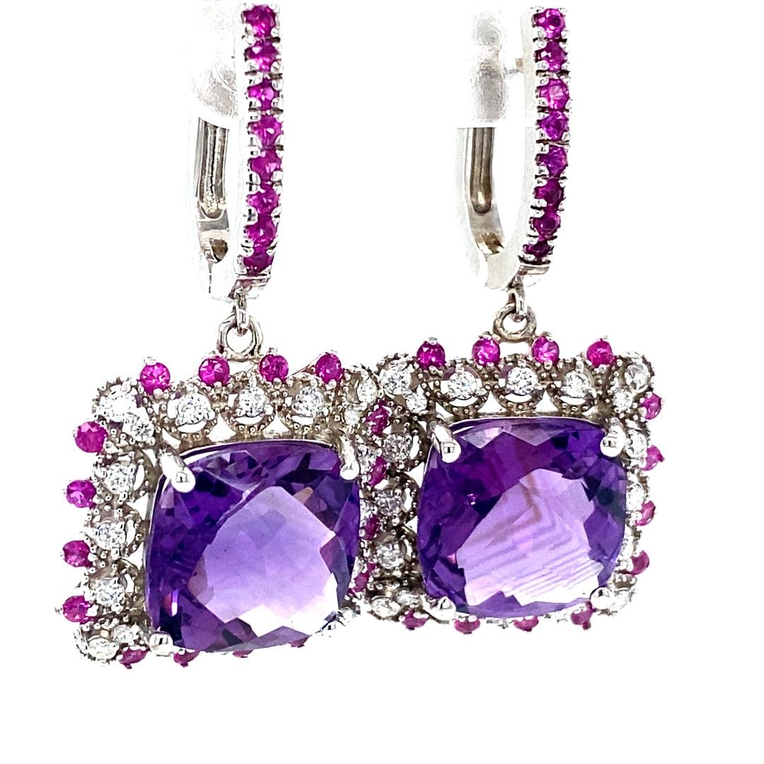 Amethyst, Pink Sapphire and Diamond Drop Earrings! 

These stunning Earrings have 2 large Cushion Cut Amethysts that weigh 12.16 Carats
 The Cushion cut Amethysts are embellished with alternating 32 Round Cut Diamonds that weigh 0.52 Carats
