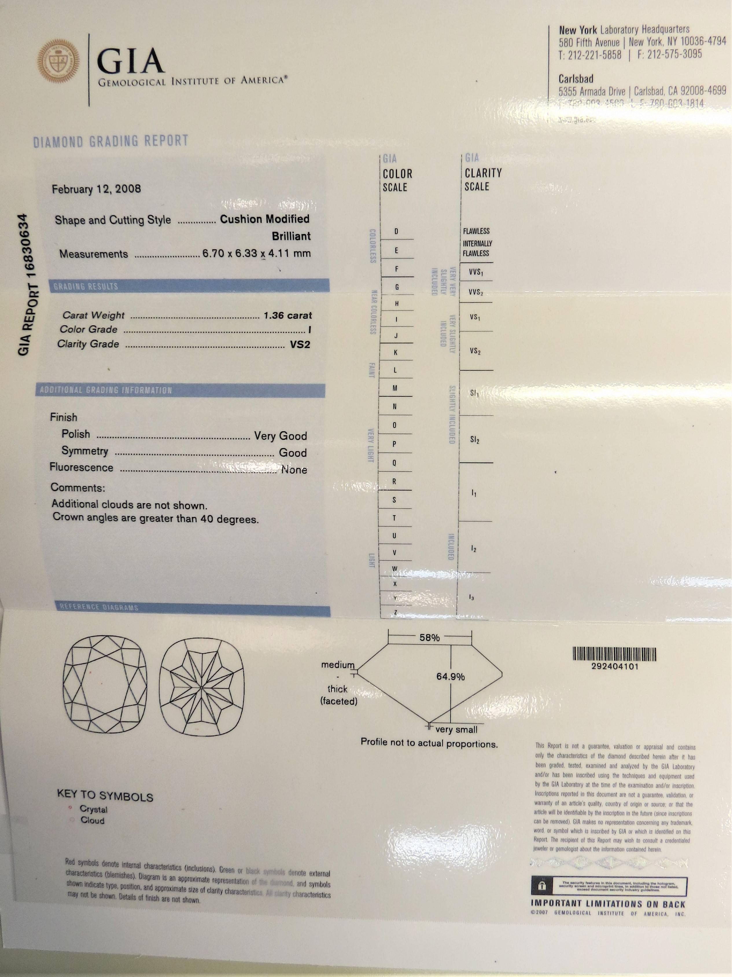 Platinum mounting bezel set with Cushion shape diamond, weighing 1.36cts, I color, VS2 clarity, GIA certified (certificate attached) surrounded by 46 full cut round diamonds weighing .55ct, G-H color, VS clarity and 2 bezel set (under gallery) full