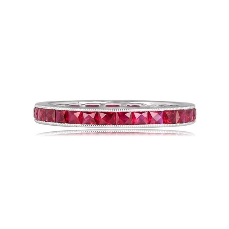 This stunning eternity band is crafted in platinum and features elongated French cut rubies, totaling 1.36 carats. The channel setting enhances the beauty of the rubies, while the band's 2.40mm width provides an elegant and comfortable fit. Fine
