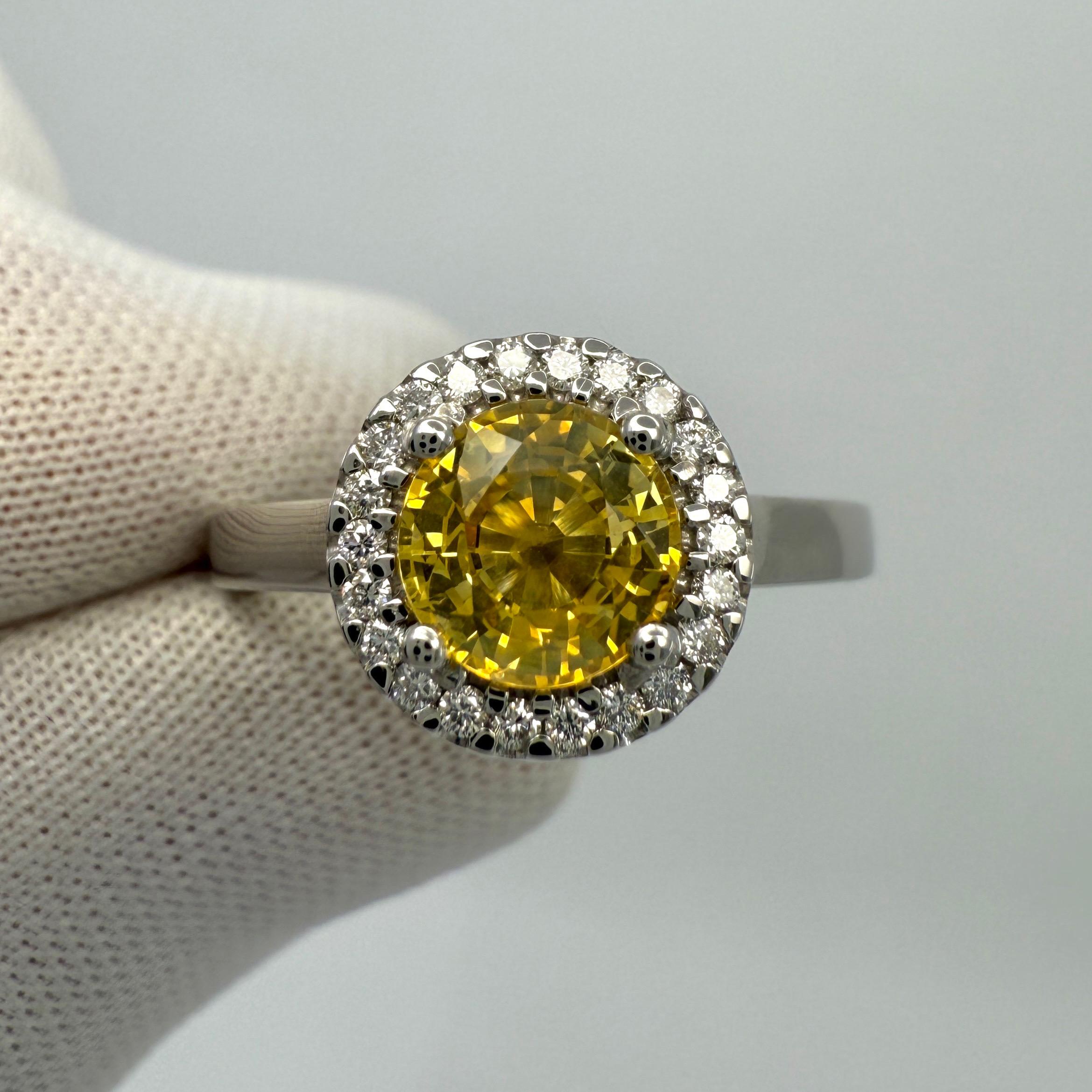 Natural Vivid Yellow Round Cut Sapphire And Diamond Platinum Halo Ring. 1.36 Carat total.

This beautiful ring features a natural 1.22ct sapphire with a stunning vivid yellow colour. Also has an excellent round cut and very good clarity. VS. Some