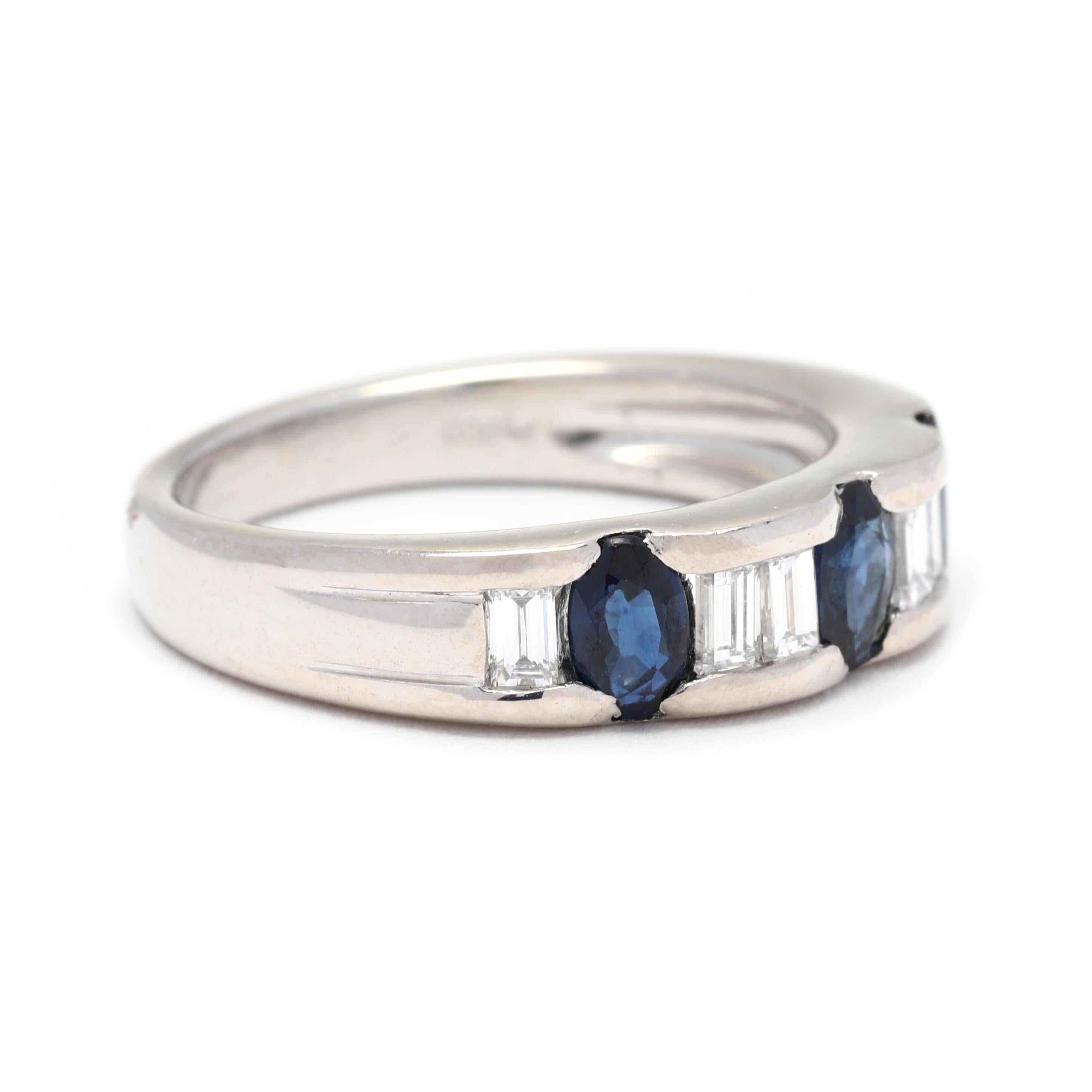 This stunning platinum band ring features a total of 1.36 carats of vibrant sapphires and sparkling diamonds. The sapphires are a beautiful deep blue color and are expertly set in between baguette cut diamonds. The ring is a size 6.25 and can be