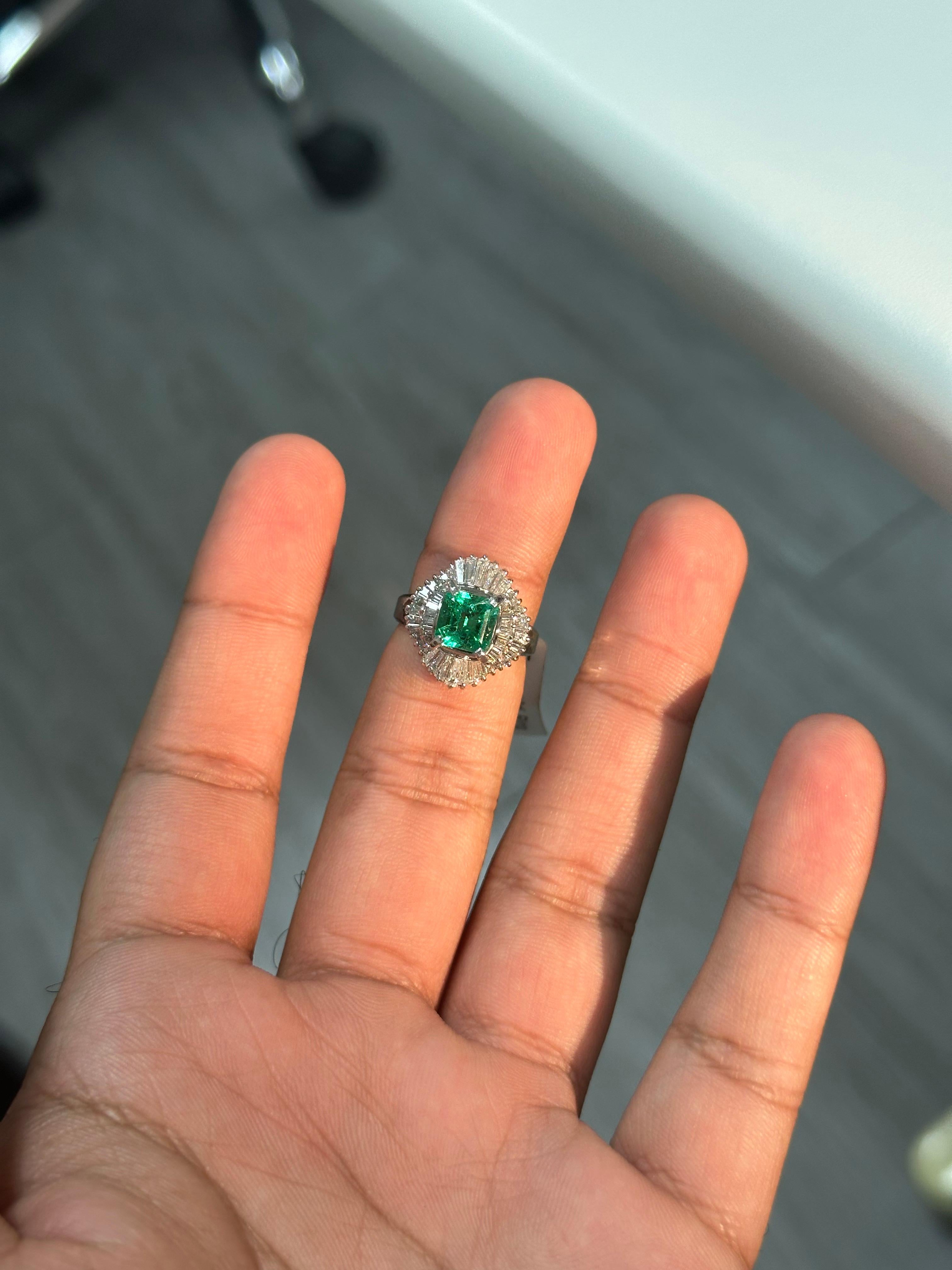 Introducing the epitome of luxury and sophistication, behold the breathtaking Art Deco inspired, Emerald Statement Ring, a true marvel in the world of fine jewelry. Crafted with precision and passion, this extravagant piece exudes opulence from