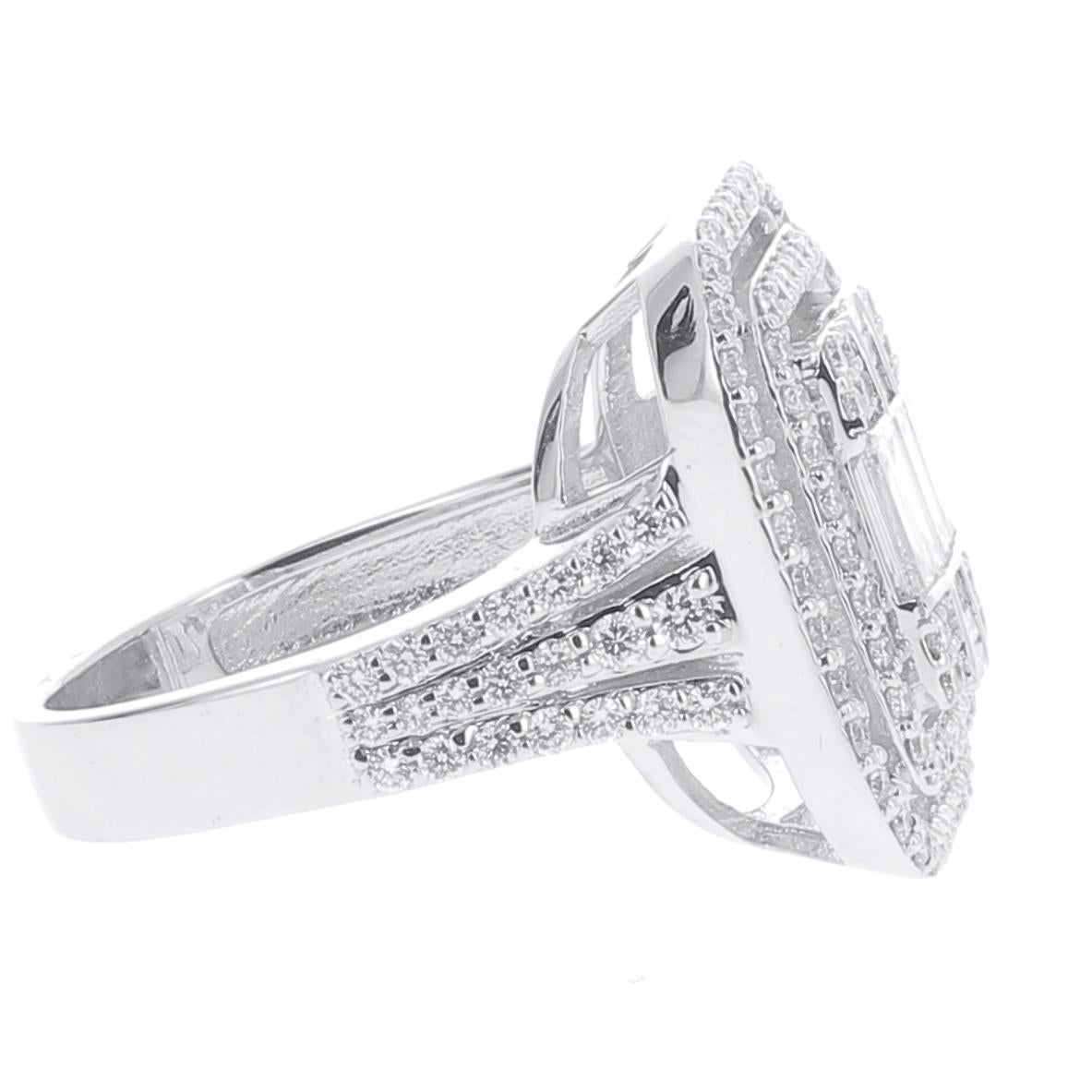 A unique Emerald Cut Illusion Diamonds Ring set with Round Diamonds and Baguettes Diamonds giving the impression of One Emerald Cut Diamond.
The ring is set with Baguettes Diamonds and Round Diamonds weighing 1.37 Carats  
The Diamonds are GVS