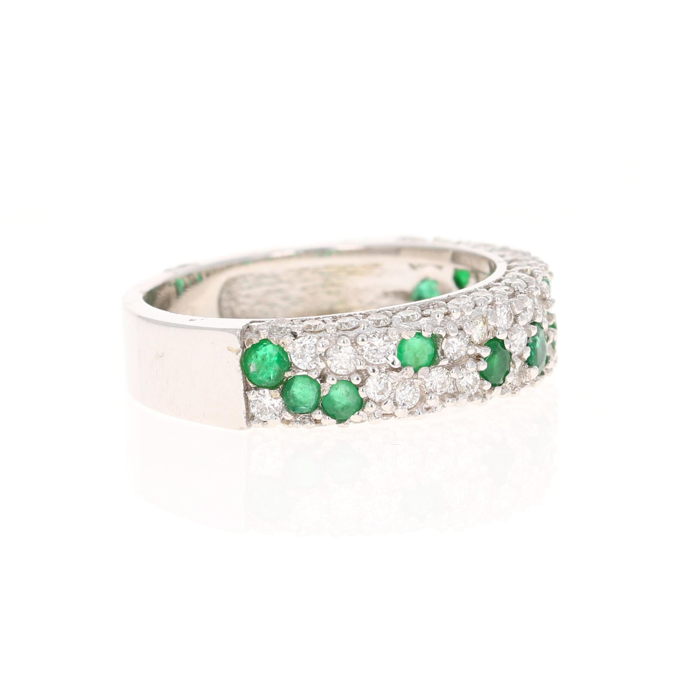 This gorgeous band has 13 Round Cut Emeralds that weigh 0.60 carats and 61 Round Cut Diamonds that weigh 0.77 carats. (Clarity: VS Color: H) The total carat weight of the ring is 1.37 carats. 

The ring is designed in 18 Karat White Gold and weighs
