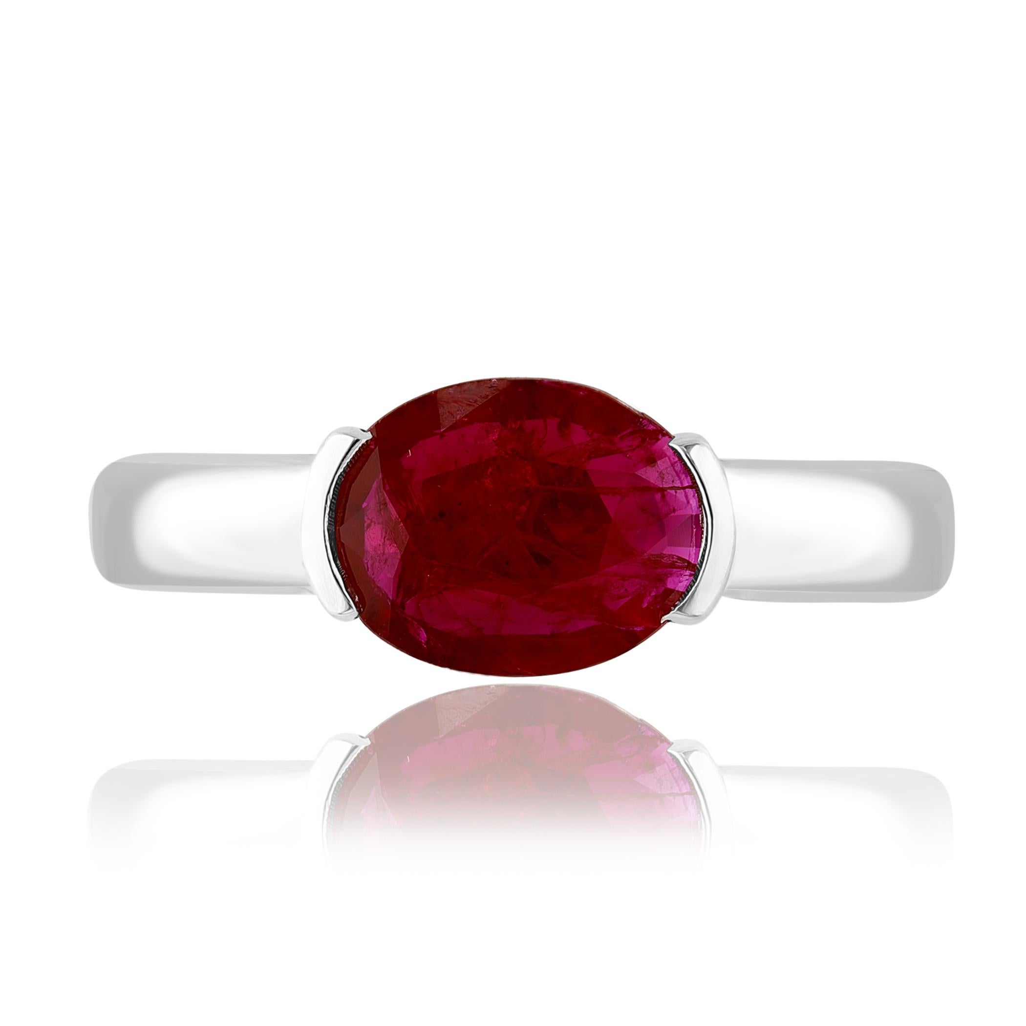 An elegant wedding band ring featuring an astonishing 1.37-carat oval cut ruby, set in a beautiful wide 14K white gold band. 

Style is available in different price ranges. Prices are based on your selection. Don't hesitate to get in touch with us