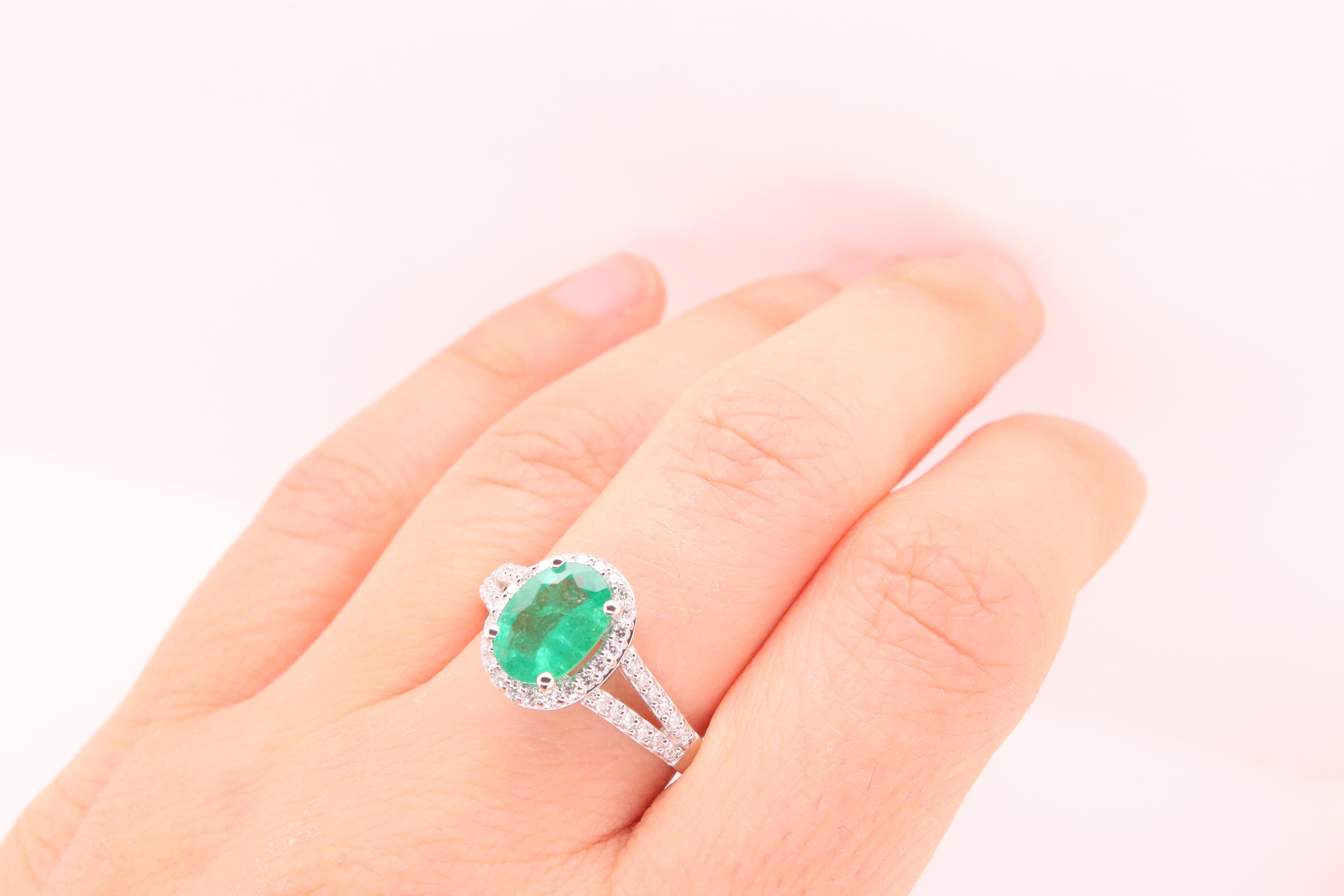Contemporary 1.37 Carat Oval Emerald and Diamond Halo Engagement Ring
