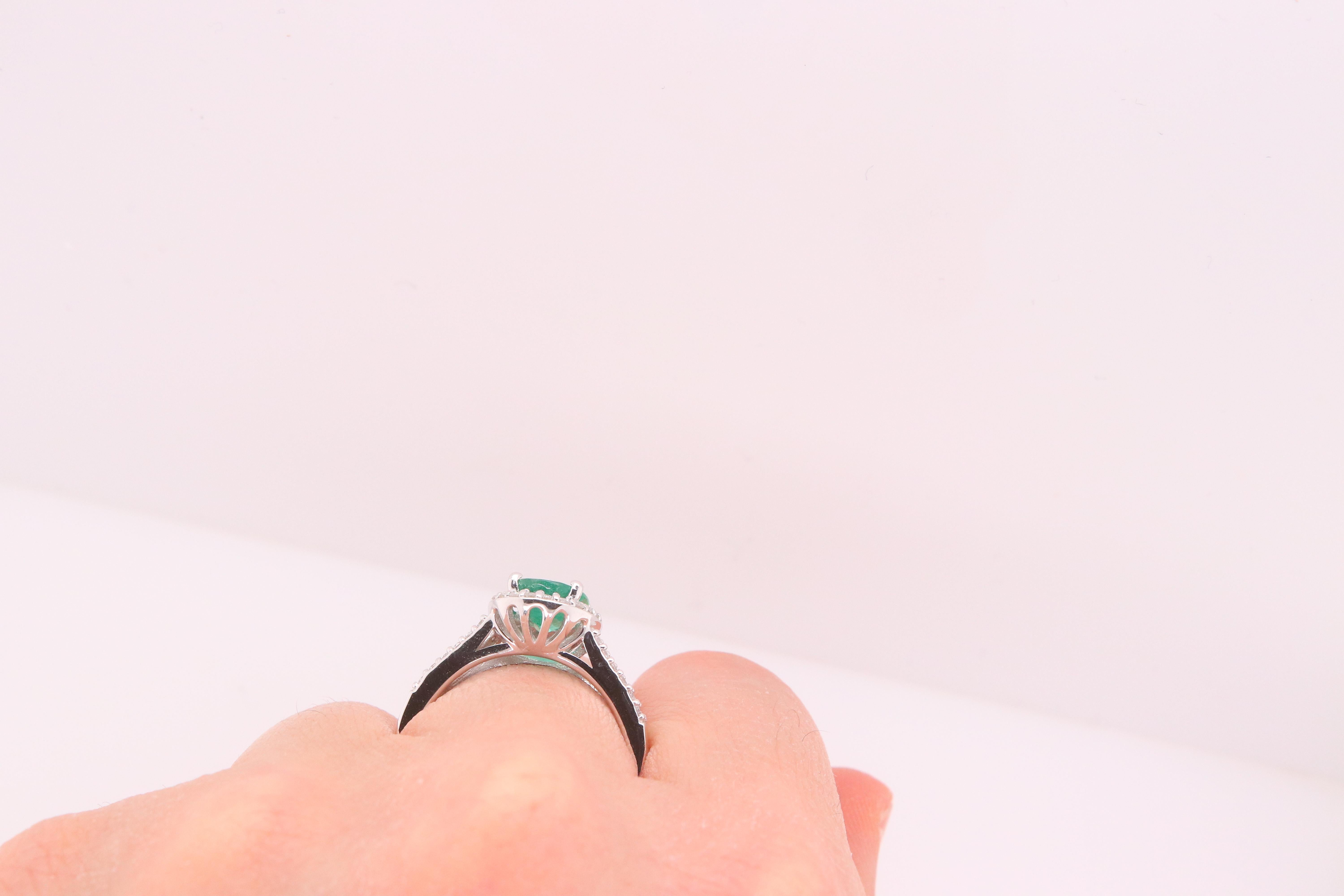 Oval Cut 1.37 Carat Oval Emerald and Diamond Halo Engagement Ring