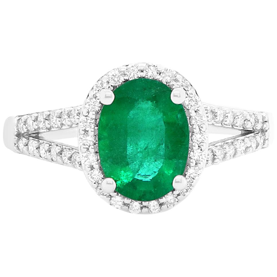 1.37 Carat Oval Emerald and Diamond Halo Engagement Ring