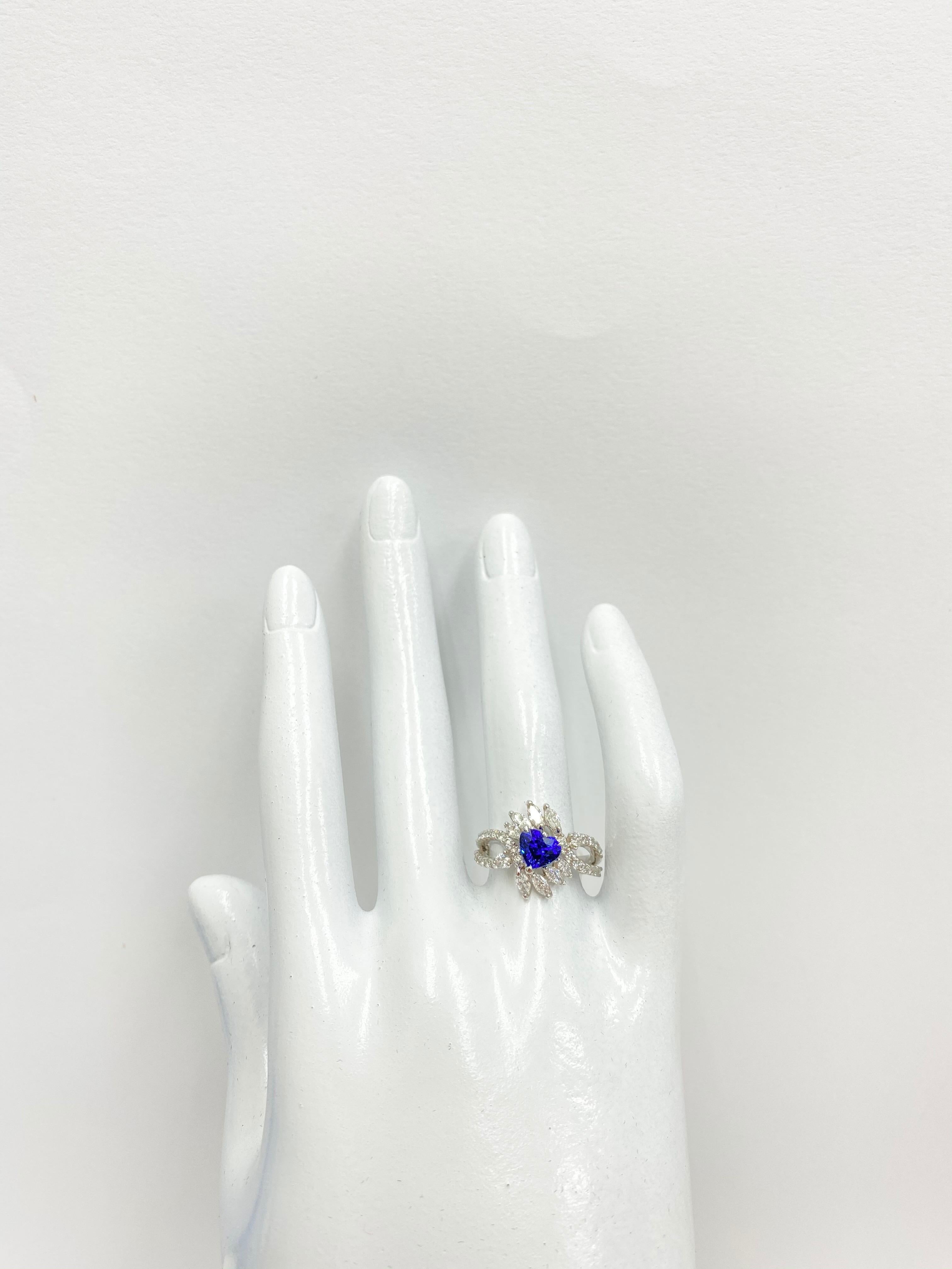 A stunning Engagement Ring featuring a 1.37 Carat Vivid Blue Sapphire and 0.97 Carats of Round Brilliant Diamond Accents set in Platinum. Sapphires have extraordinary durability - they excel in hardness as well as toughness and durability making