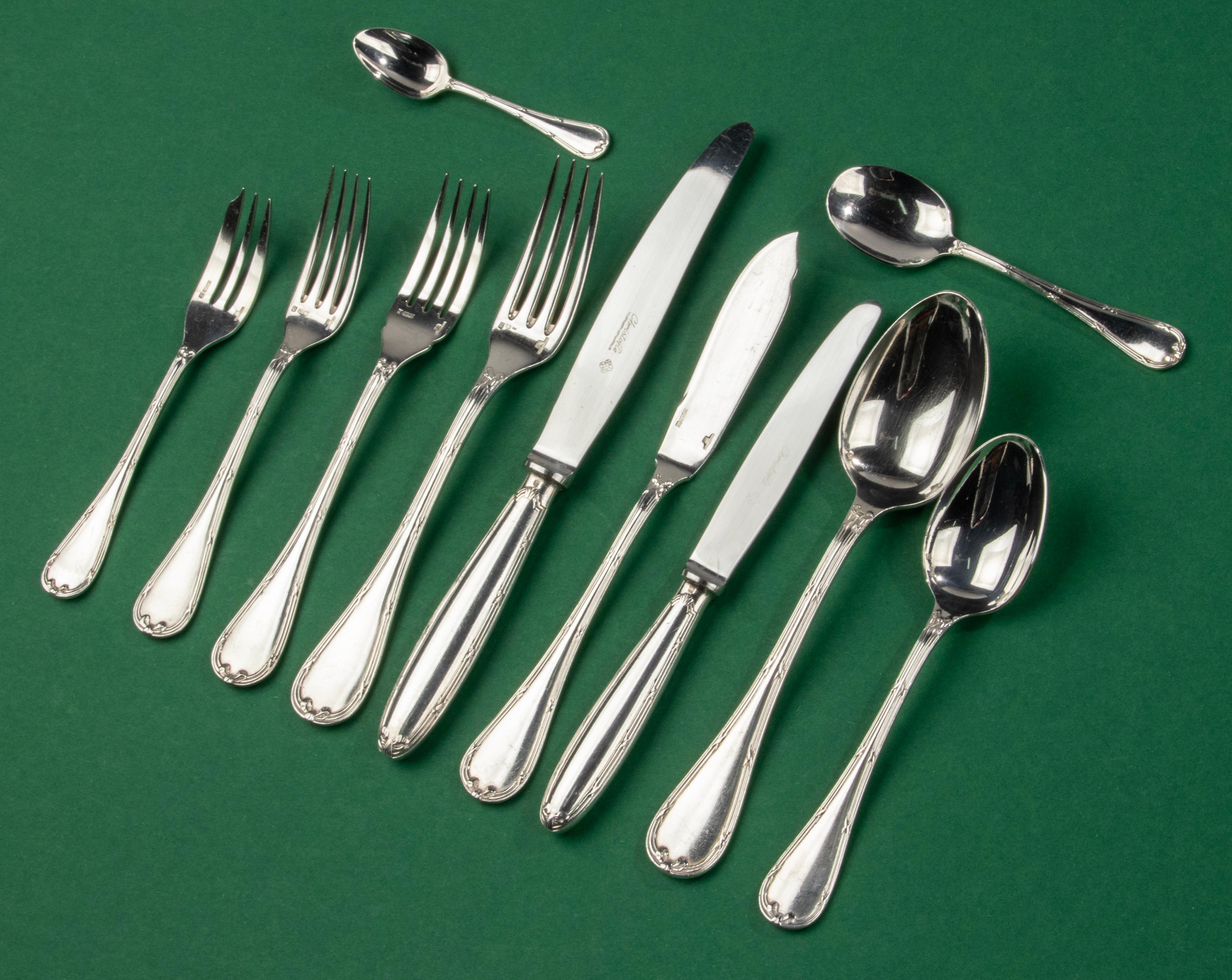 A great set of silver plated tableware, made by the French brand Christofle, from the series Rubans Croisés. The set is complete for 12 persons and in great condition. It looks like it has hardly been used. Beautiful colour and brilliance. 
- 12