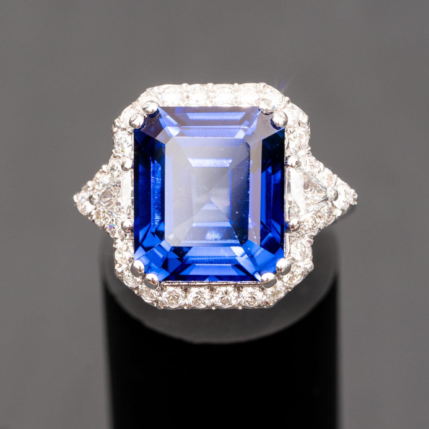 This gorgeous blue sapphire ring will impress everyone around you. It features a large emerald 13.70 carat gemstone, adorned with 1.20 carat natural diamonds.

Diffused Sapphire
Mineral: Corundum
Hardness: 9 on Moh's scale
Emerald Sapphire