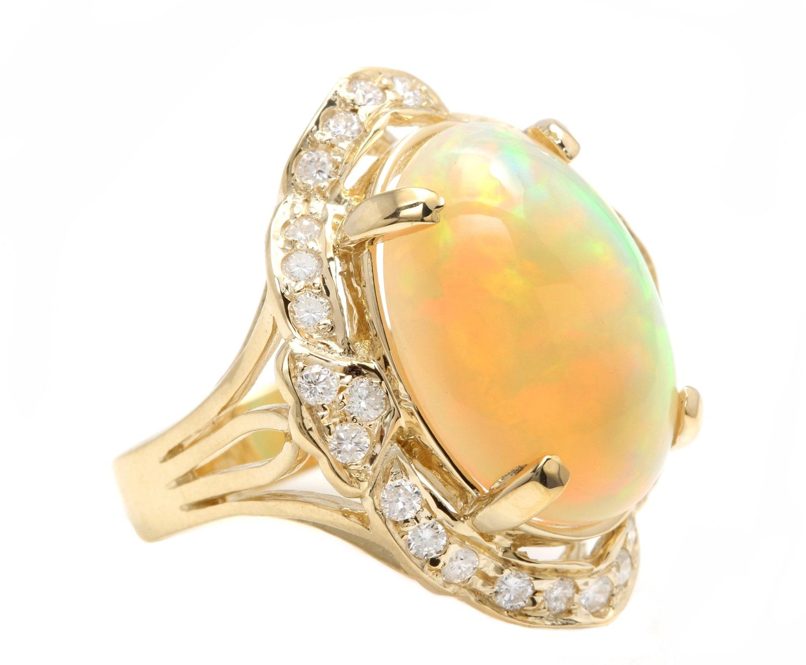 13.70 Carats Natural  Impressive Ethiopian Opal and Diamond 14K Solid Yellow Gold Ring

The opal has beautiful fire, pictures don't show the whole beauty of the opal!

Suggested Replacement Value: $6,800.00

Total Natural Opal Weight is: Approx.