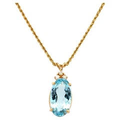 13.71 Carat Oval Blue Topaz and Diamond Gold Vintage Pendant Necklace