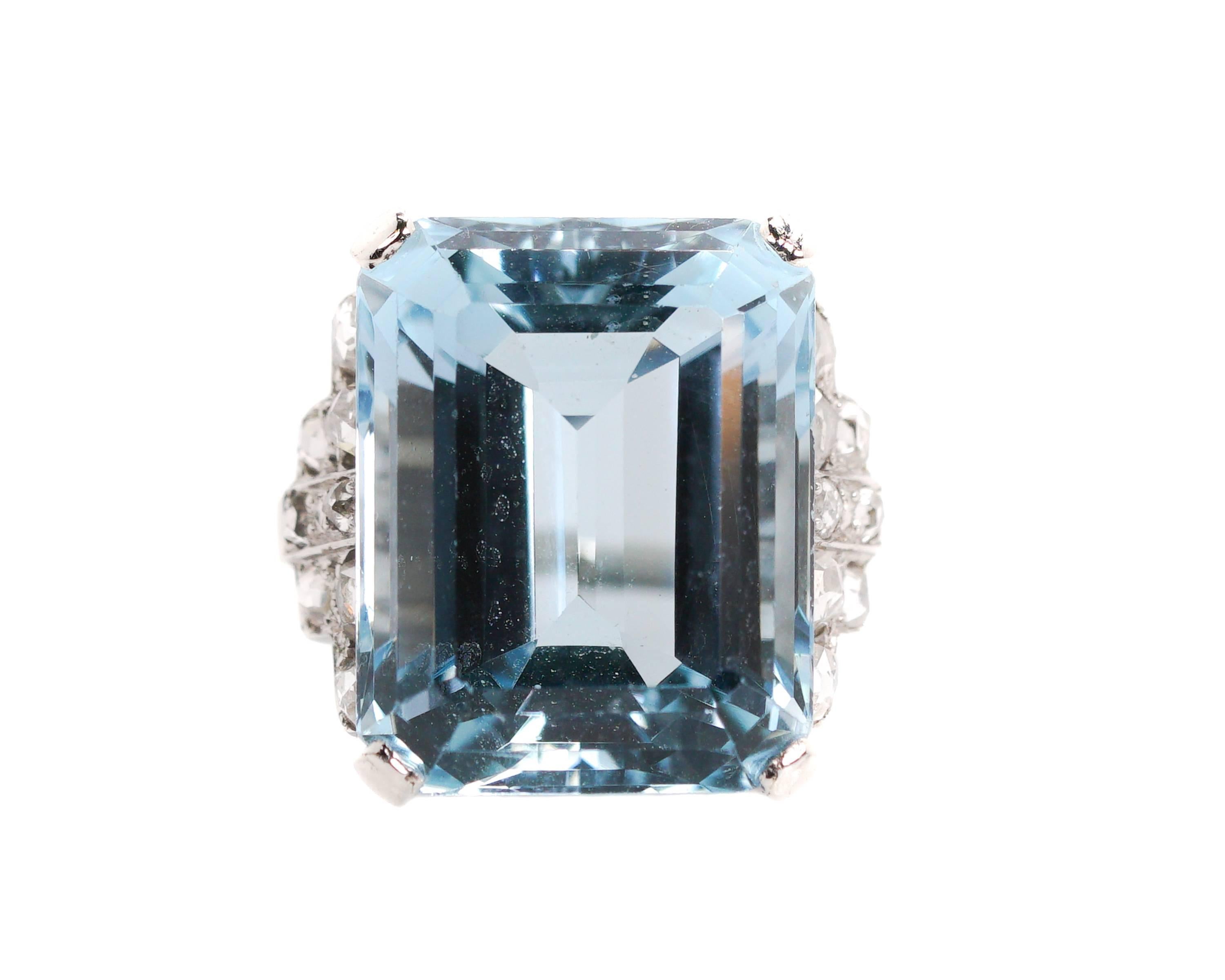 13.75 carat Aquamarine Ring - 18 Karat White Gold, Aquamarine, Diamonds

Features:
13.75 carat Emerald Step cut Aquamarine
16 Rose cut Diamonds
18 Karat White Gold Setting
All gemstones are prong set
Cathedral Setting with Open Gallery

Fits a size