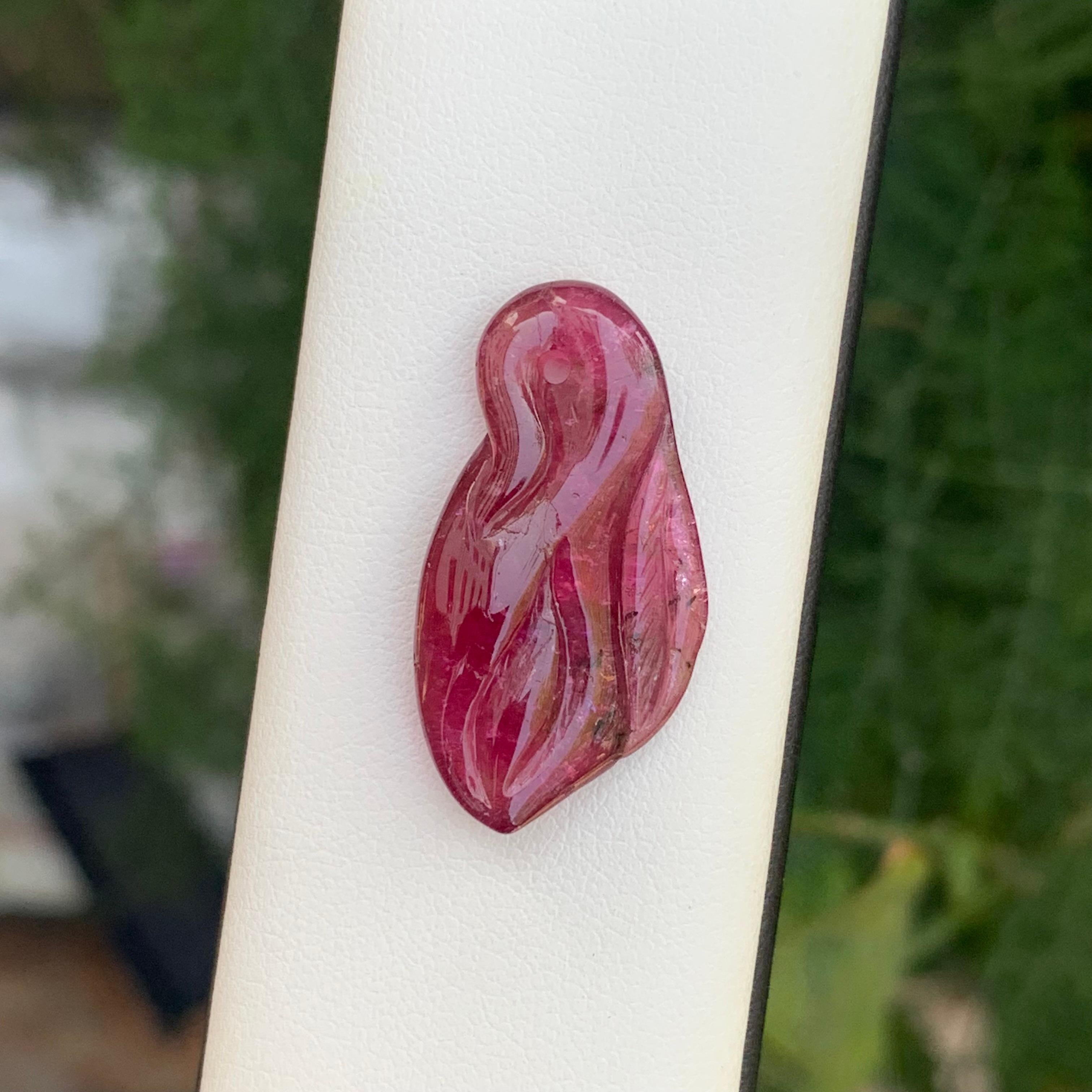Product Information:

Natural Loose Tourmaline Carving 
Weight: 13.75 Carats
Dimension: 28x15x5.5 Mm
Origin: Madagascar Africa
Color: Pink Rubellite 
Treatment: Non
Certificate: On Demand 