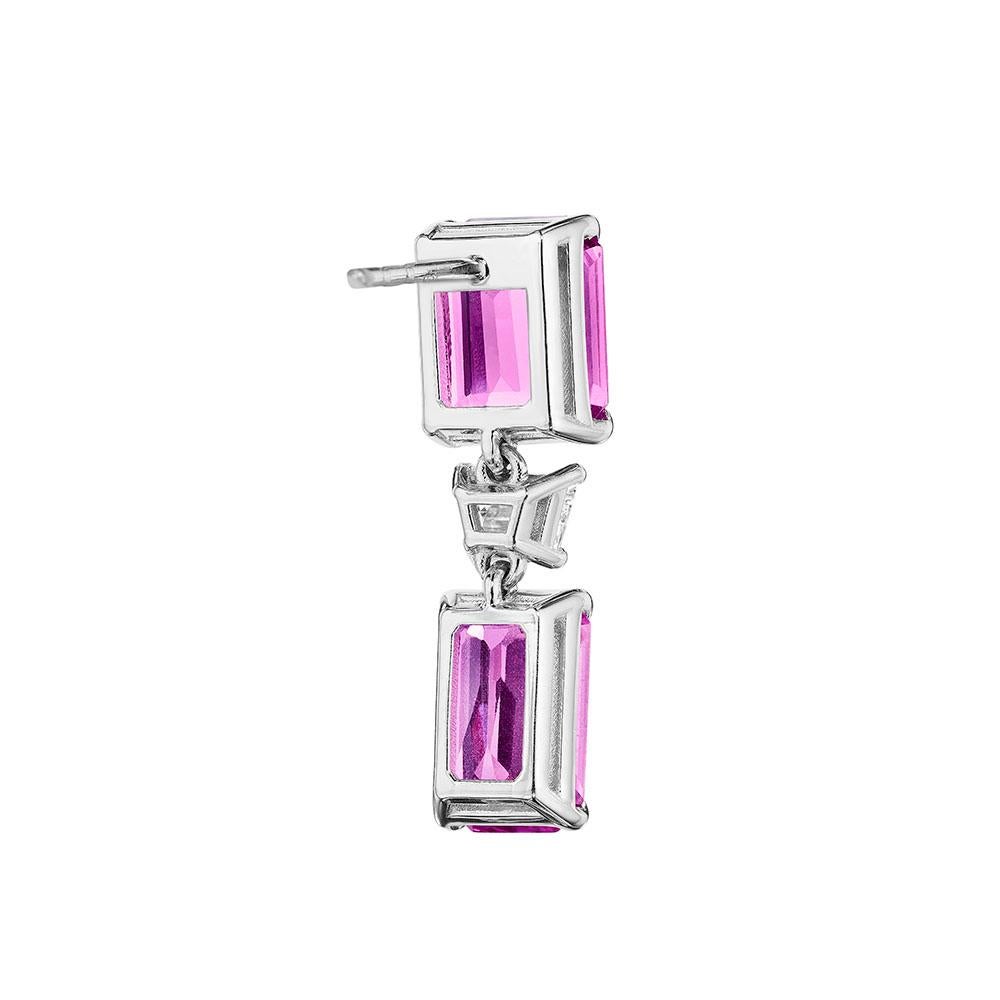 •	18KT White Gold
•	13.78 Carats
•	Sold as a pair

•	Number of Trapezoid Diamonds: 2
•	Carat Weight: 0.68ctw

•	Number of Emerald Cut Pink Sapphires: 4
•	Carat Weight: 13.10ctw

•	Crafted in 18KT white gold, this sleek and stylish pair of earrings