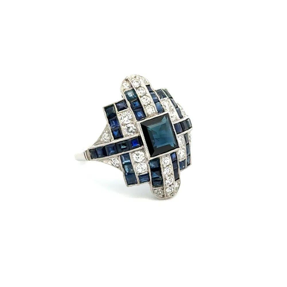 Simply Beautiful! Vintage Square Blue Sapphire, Diamond and Sapphire Platinum Cocktail Ring. Centering a securely nestled Hand set 1.37 Carat Square Sapphire, 0.90tcw Diamonds and Complimented by Sapphires, weighing approx. 2.00tcw. The ring is
