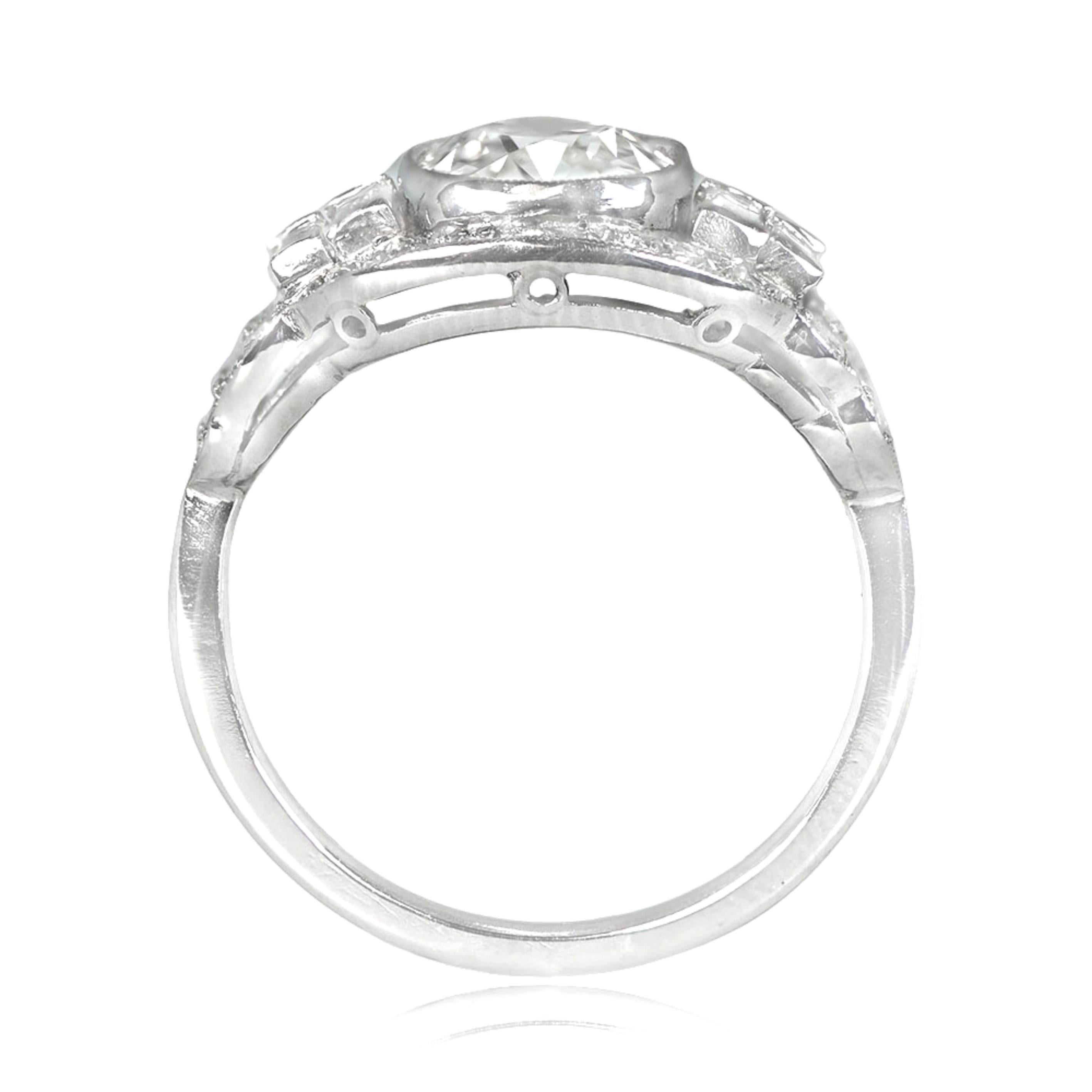 The Oakland Ring is a hand-crafted platinum piece featuring an antique cushion cut diamond weighing 1.37 carats with J color and SI1 clarity. It also boasts a graduating design of channel-set baguette and old European cut diamonds extending along