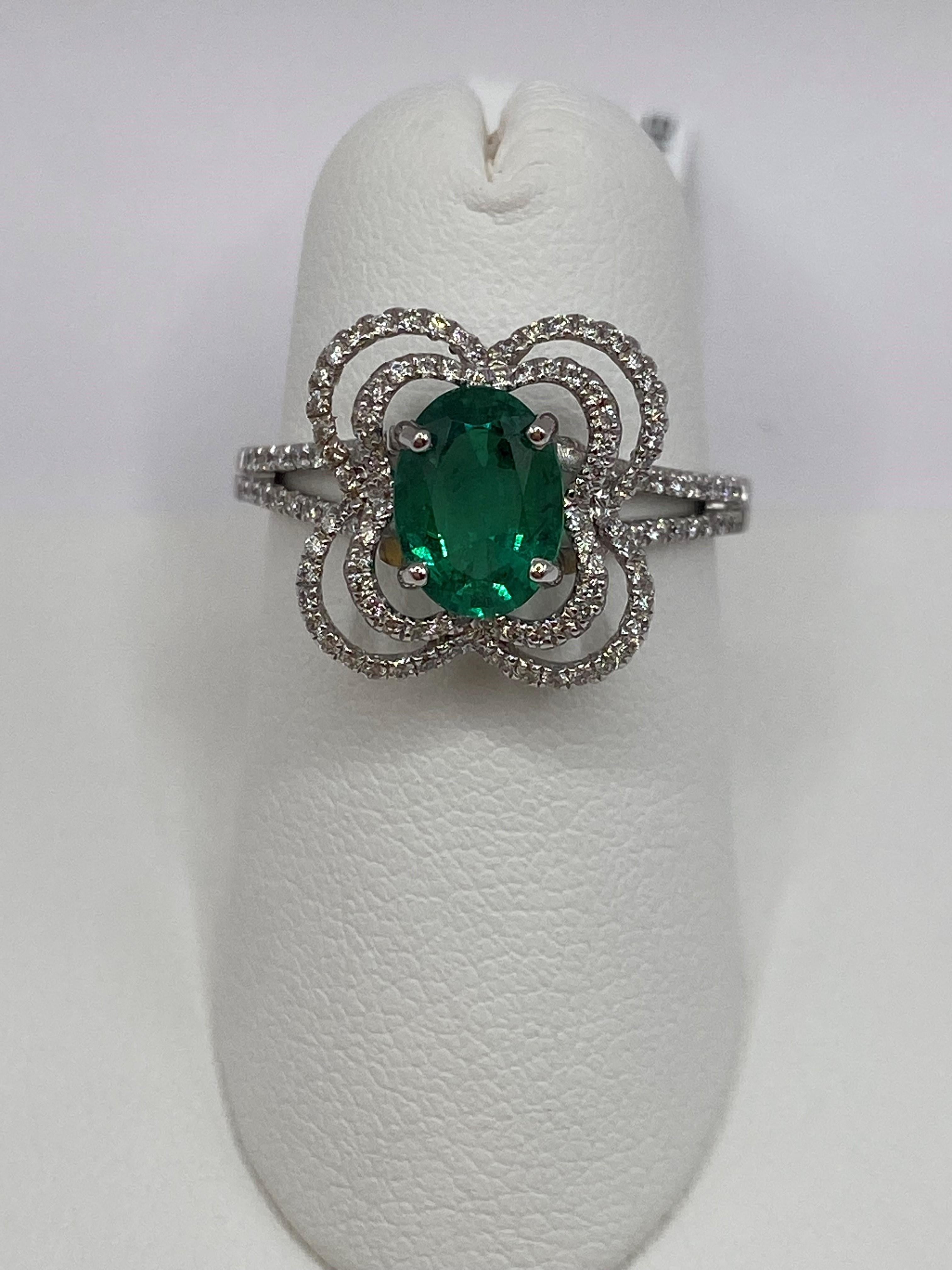18KT White Gold
Ring Size: 6.5
(ring is a size 6.5, but is sizable upon request)

Number of Oval Cut Emeralds: 1
Carat Weight: 1.02ct
Stone Size: 8 x 6mm

Number of Round Diamonds: 124
Carat Weight: 0.35ctw