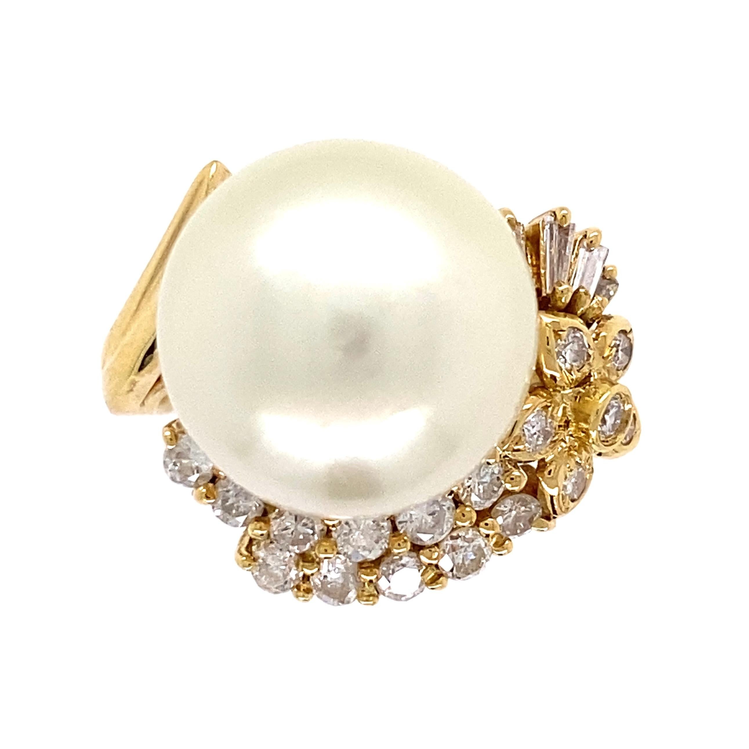 Simply Beautiful! Finely detailed South Sea Pearl and Diamond Cocktail Ring. Center securely nestled with a Hand set 13.7mm South Sea Pearl, enhanced with Hand set Diamonds, weighing approx. 0.70 total carat weight. Dimensions 1.23” l x 0.84” w x