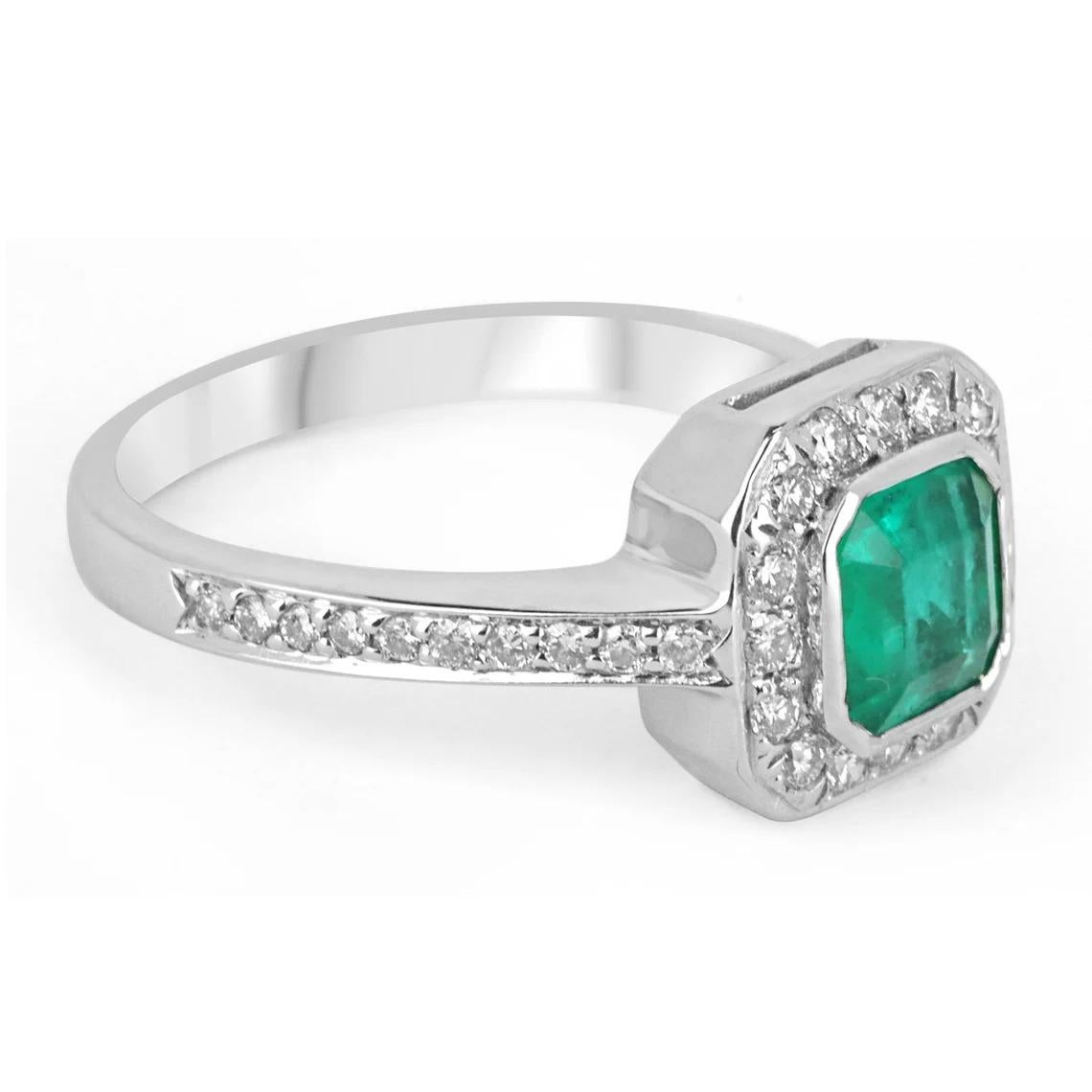 Featured is this beautiful emerald and diamond engagement ring. Stunning from any angle is this full 0.95-carat, Colombian emerald. Cut in the shape of an Asscher, with a gorgeously vivid, medium-dark green color. The stone is accented with