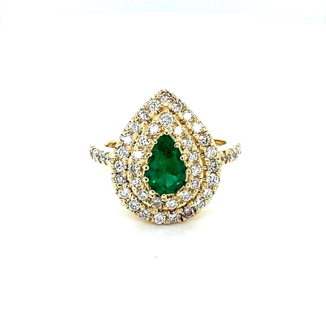 Modern 1.38 Carat Colombian Emerald Double Halo Diamond Yellow Gold Ring For Sale