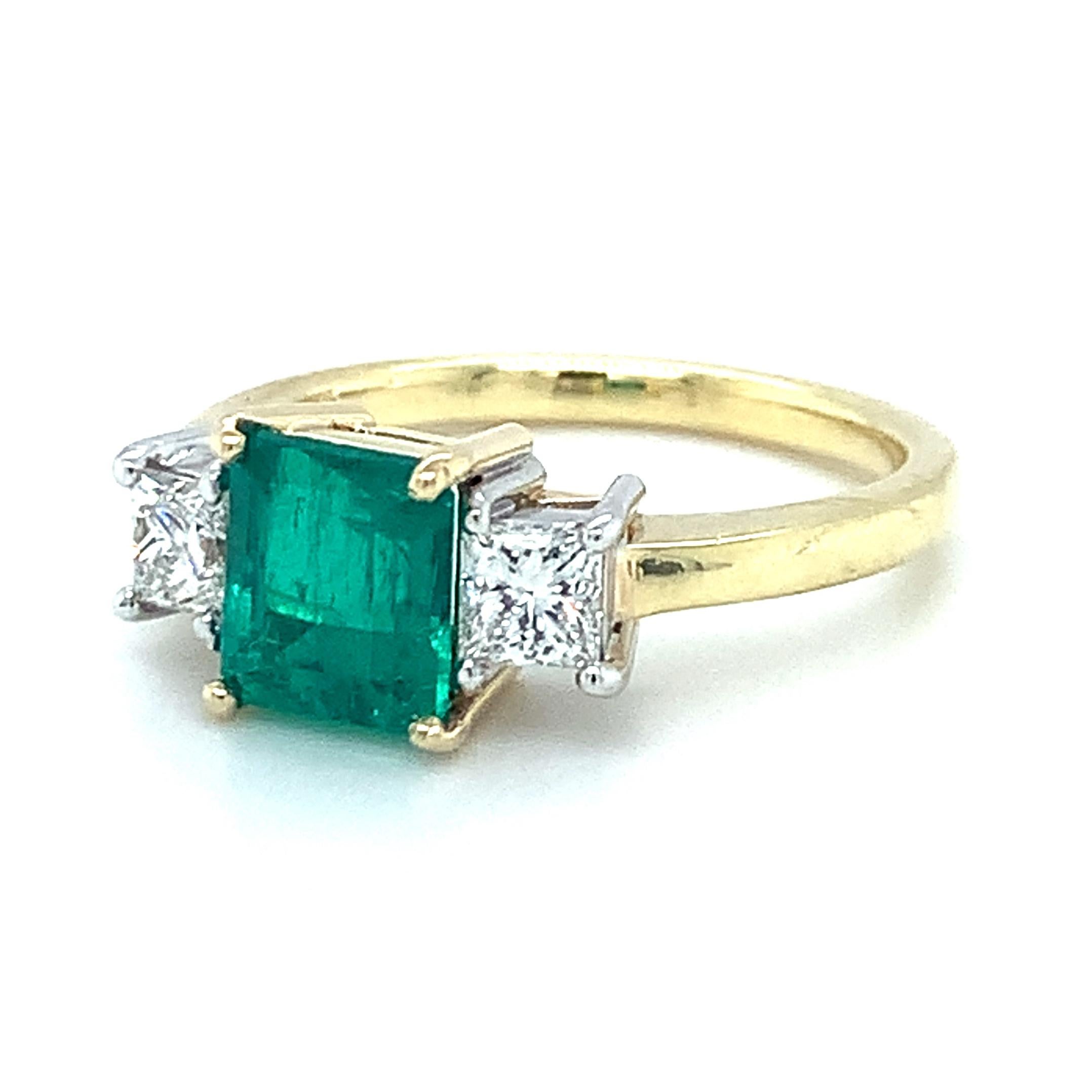 white gold ring with green stone