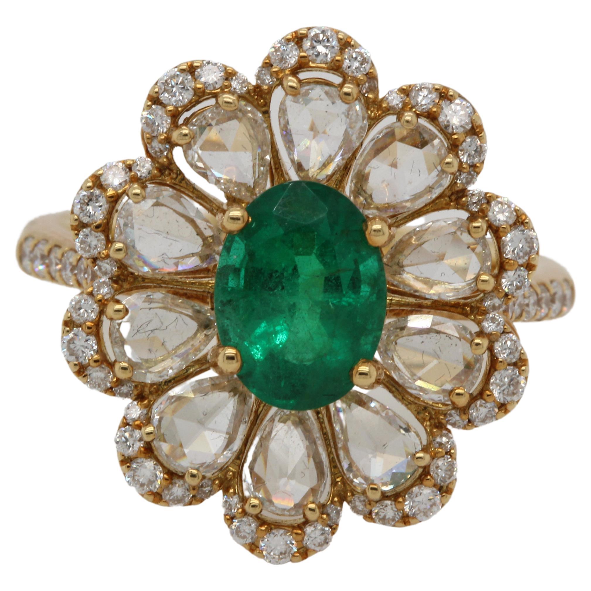 This emerald and diamond ring is a timeless piece of jewelry. The weighty gold setting and gorgeous emerald make this ring easy to wear with everything from jeans to dresses. The rich color of the emerald compliments any skin tone, making it a