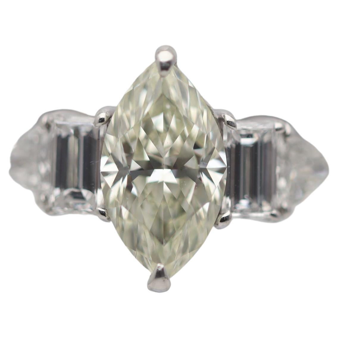 1.38 Carat Fancy Light-Yellow Marquise Diamond Platinum Engagement Ring For Sale