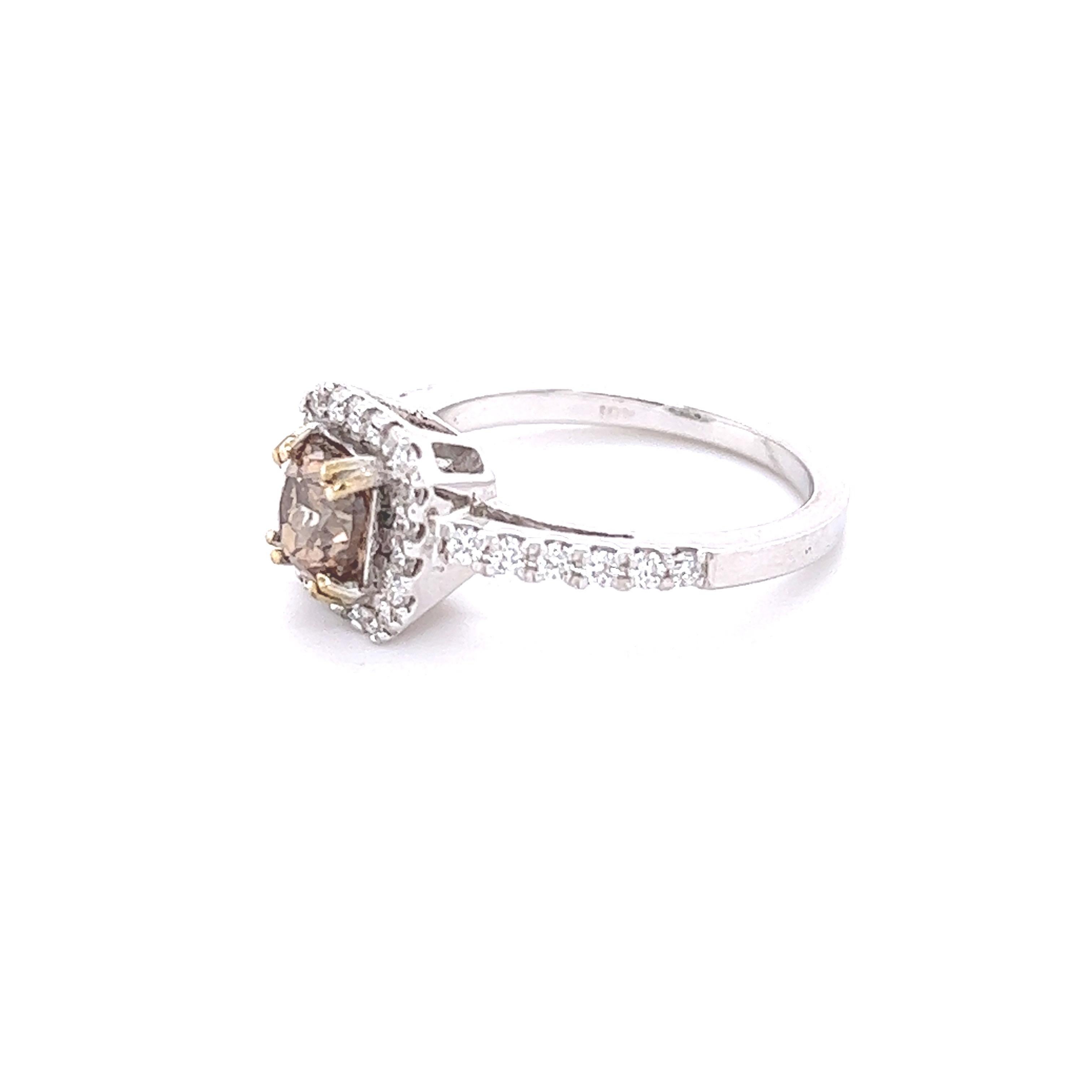 This ring has a Natural Cushion Cut Champagne Brown Diamond that weighs 1.02 carats and it is surrounded by 32 Round Cut White Diamonds that weigh 0.36 carats. Clarity: VS, Color: H
The center champagne diamond measures at 6 mm x 5 mm. 
The total