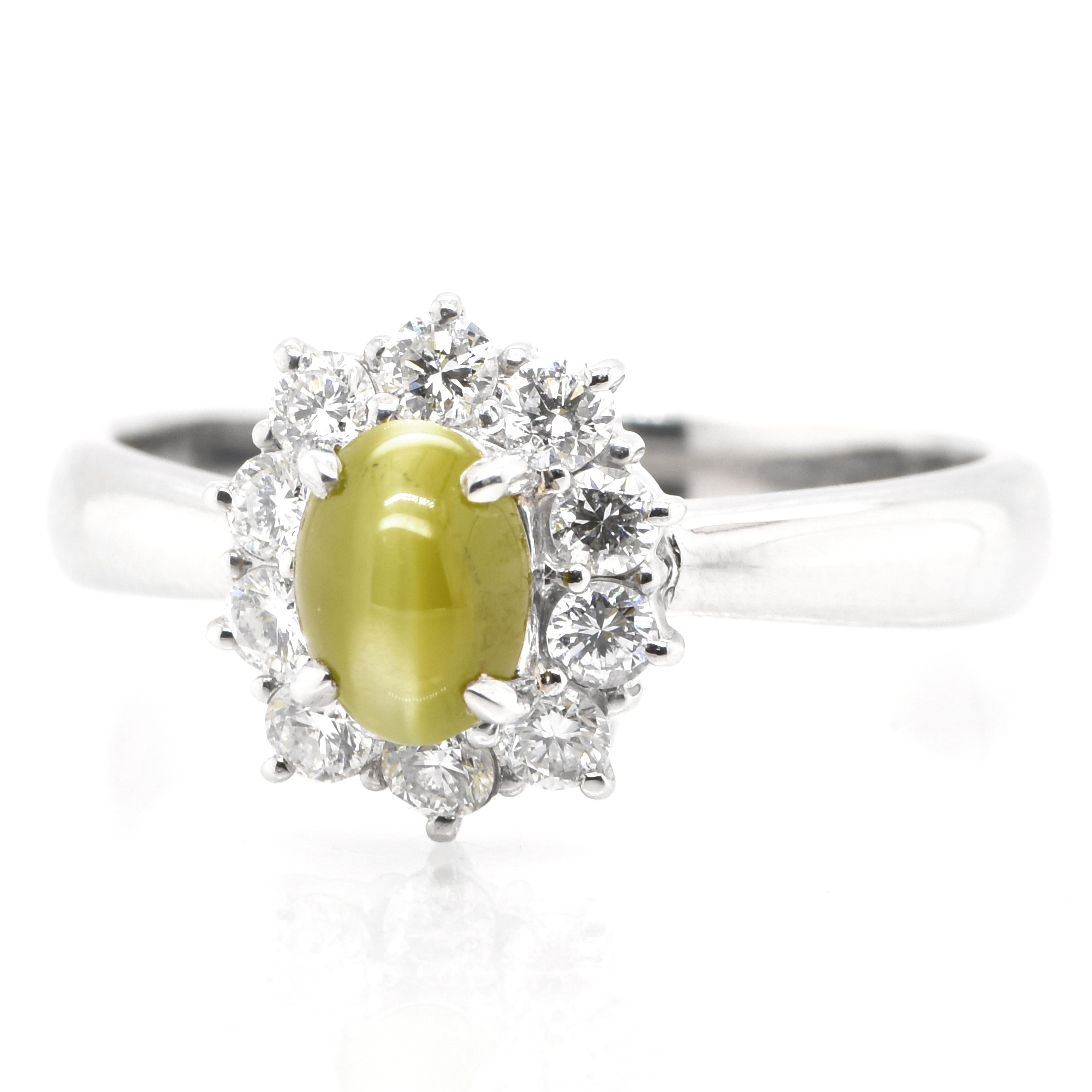 A stunning Ring featuring a 1.38 Carat Natural Cat's Eye Chrysoberyl and 0.41 Carats Diamond Accents set in Platinum. Cat's Eye Chrysoberyl exhibit a unique, naturally occurring phenomena called Chatoyancy or 