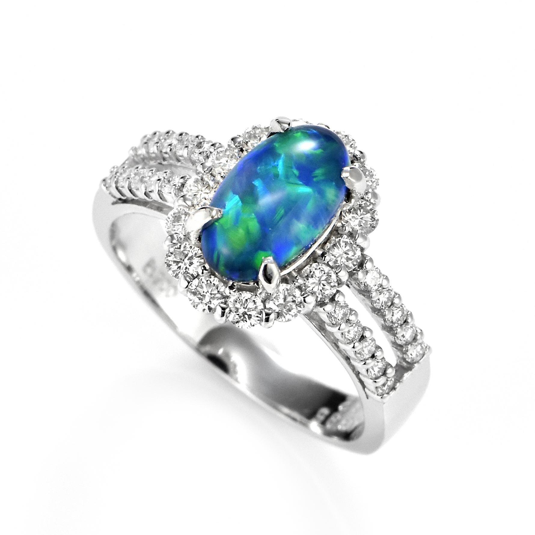 A beautiful ring featuring a 1.385 Carat Australian Black Opal and 0.62 Carat Diamonds made in Platinum. The Opal displays very good play of color! Opals are known for exhibiting flashes of rainbow colors known as 