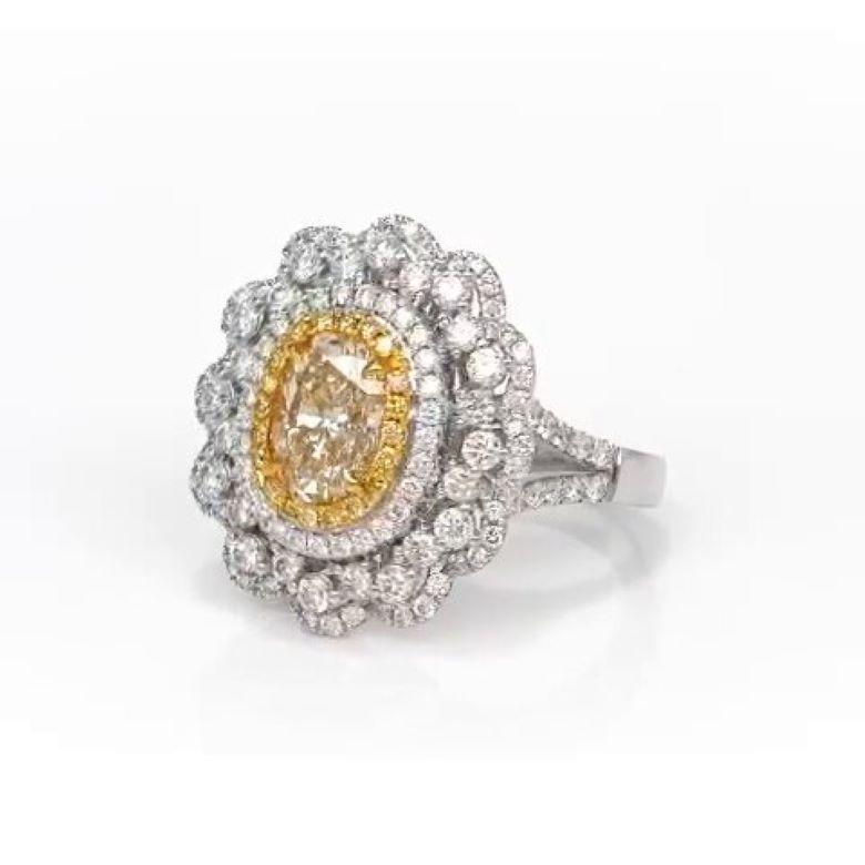 Art Deco 1.38 Carat Oval Shape Fancy Yellow Diamond Engagement Ring For Sale
