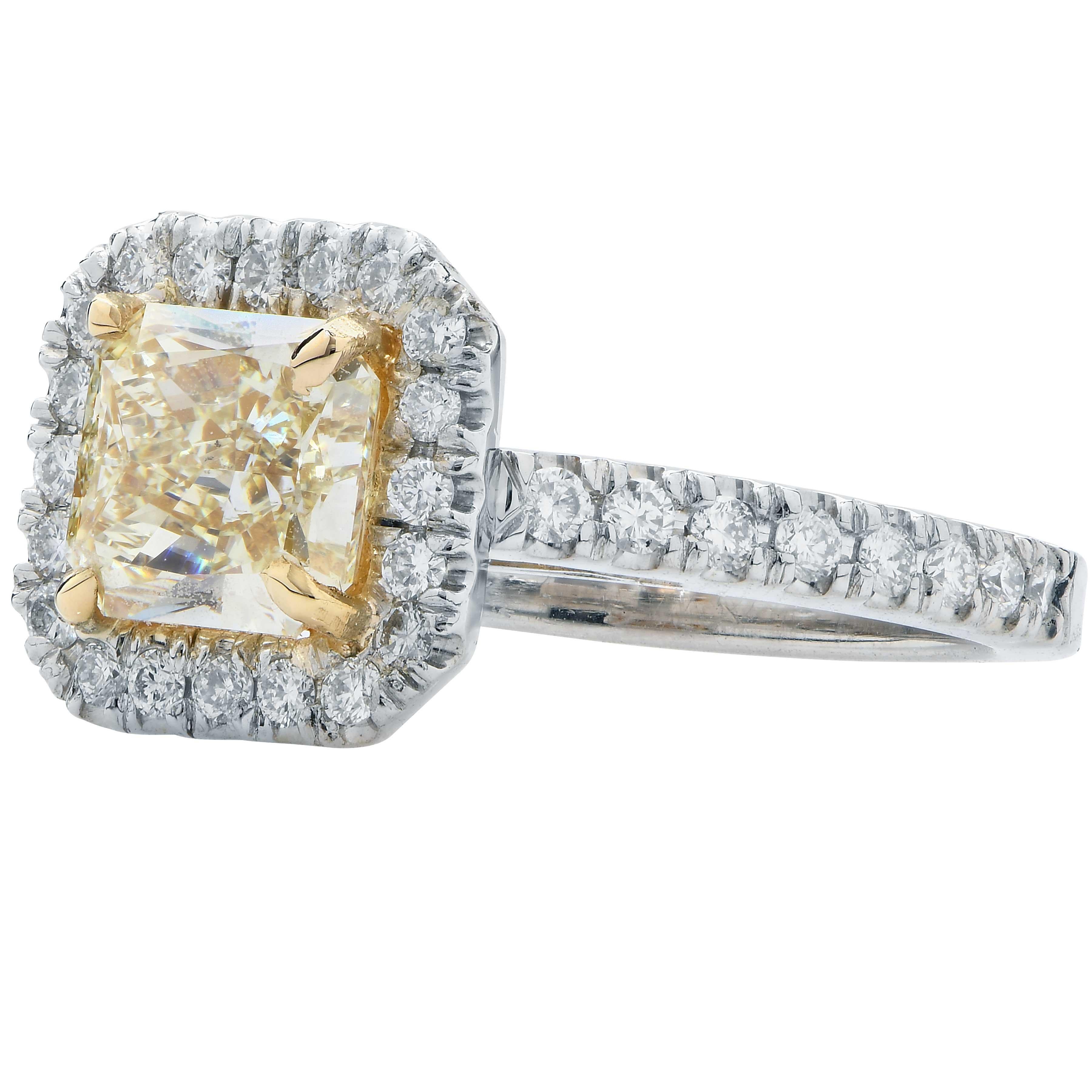 1.38 Carat Radiant Cut Yellow Diamond in Platinum Engagement Ring adorned with 36 round brilliant cut diamonds with an estimated total weight of .54 carats.
Ring Size: 5 1/2
Metal Type: Platinum 
Metal Weight: 7.2 Grams