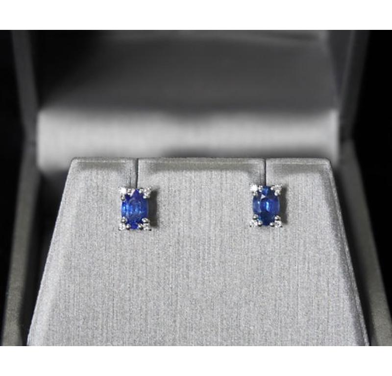 Sapphire Weight: 1.38 CT, Measurements: 6x4 mm, Diamond Weight: 0.05 CT 1.2 mm, Metal: 18K White Gold, Gold Weight: 1.71 gm, Shape: Oval, Color: Blue, Hardness: 9, Birthstone: September